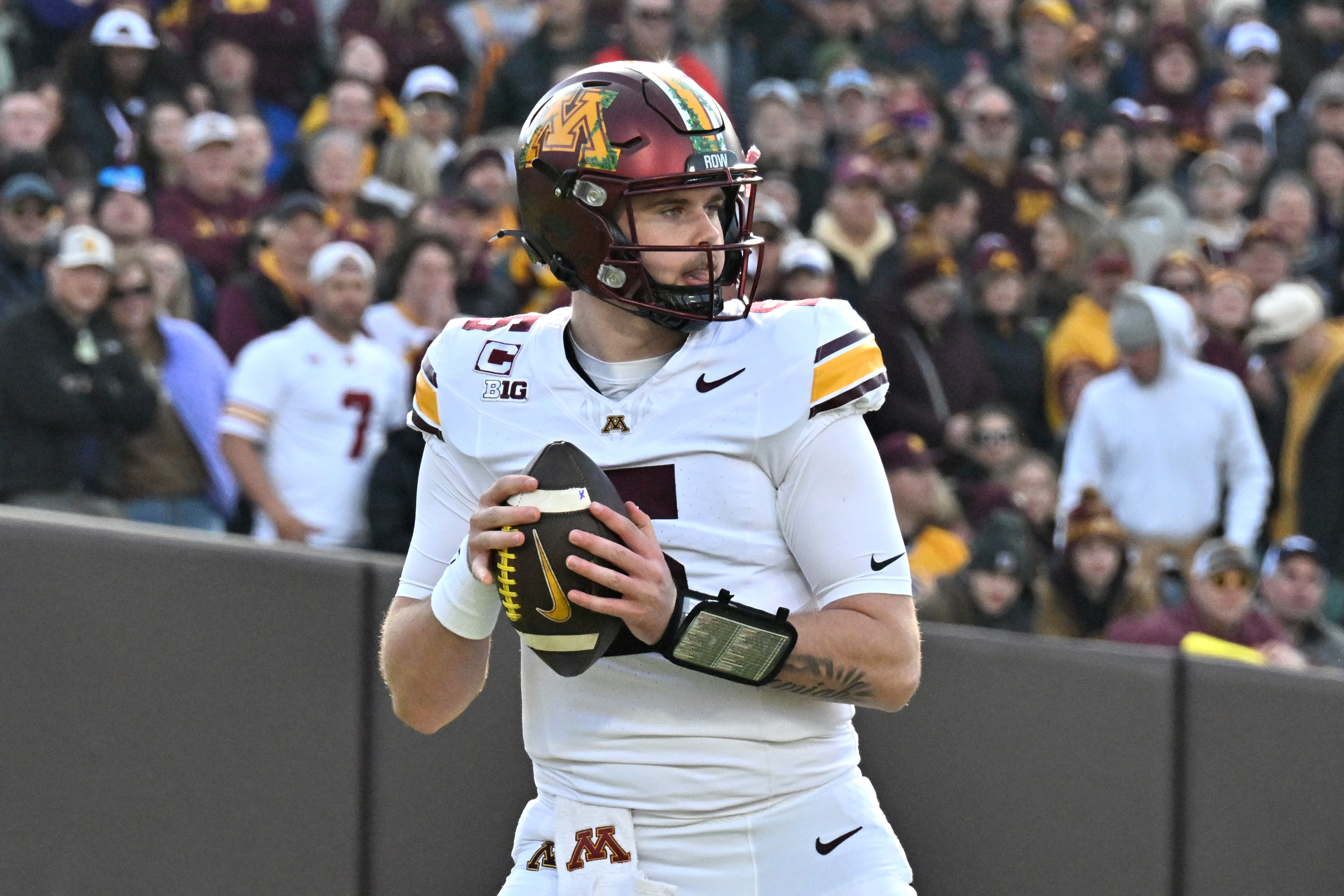 Minnesota Golden Gophers quarterback Drake Lindsey (5) scans the field as we break down our Eastern Illinois vs. Minnesota prediction.