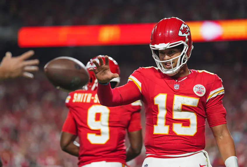 Kansas City Chiefs starting quarterback Patrick Mahomes retrieves a touchdown ball as we look at the Winning for Missouri Education ad campaign.