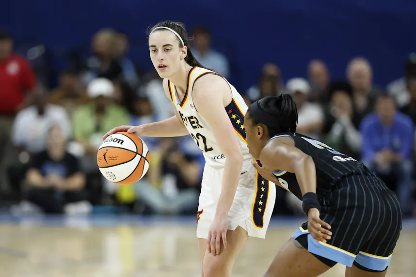 Indiana Fever guard Caitlin Clark (22) brings the ball up court against the Chicago Sky at Wintrust Arena as we offer our best Fever vs. Sky prediction and expert picks for Friday.