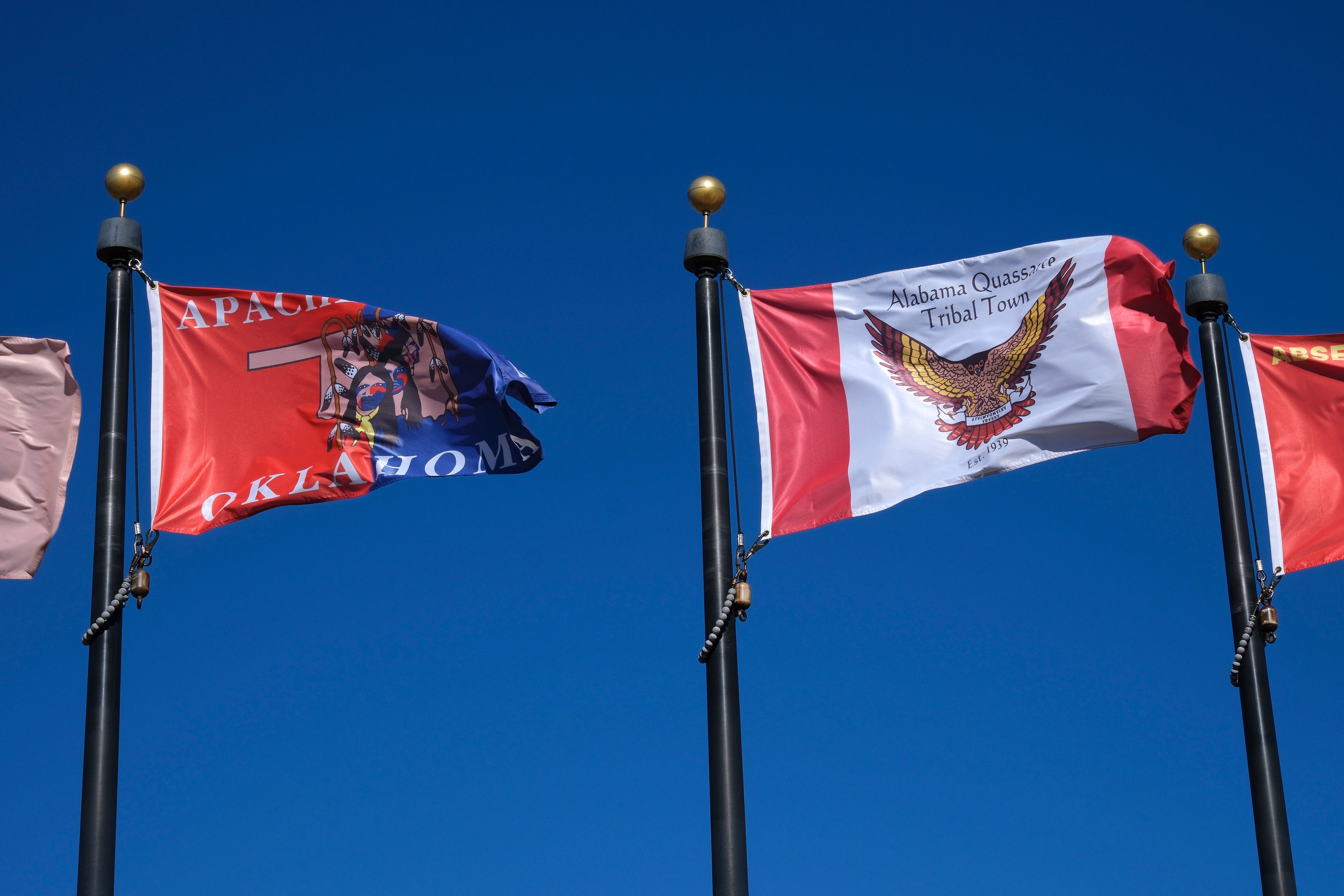 Apache Tribe (left) and Alabama-Quassault Tribal Town flags as we look at the Alabama-Quassault Tribal Town partnership with Kalshi