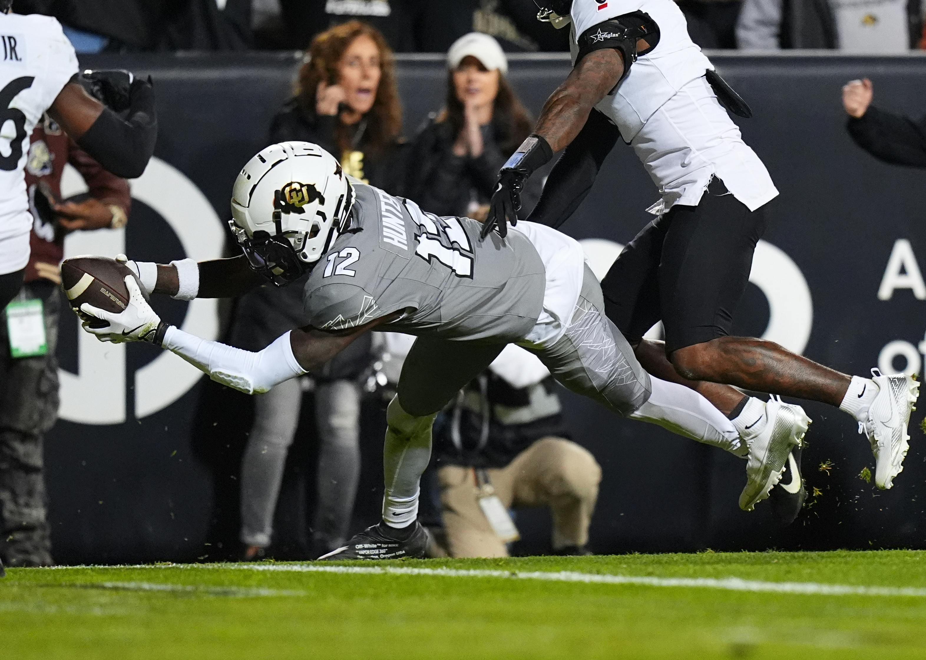 Colorado wide receiver Travis Hunter dives for a touchdown against Cincinnati. Hunter has the second-shortest 2025 NFL Draft odds to go No. 1. 