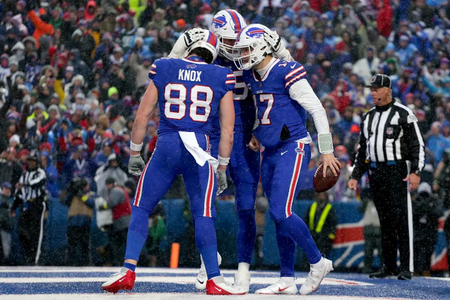 Dawson Knox, Spencer Brown, and Josh Allen of the Buffalo Bills celebrates a touchdown from Allen in the fourth quarter of a game against the New York Jets at Highmark Stadium in Orchard Park, New York. Photo by Joshua Bessex/Getty Images via AFP.