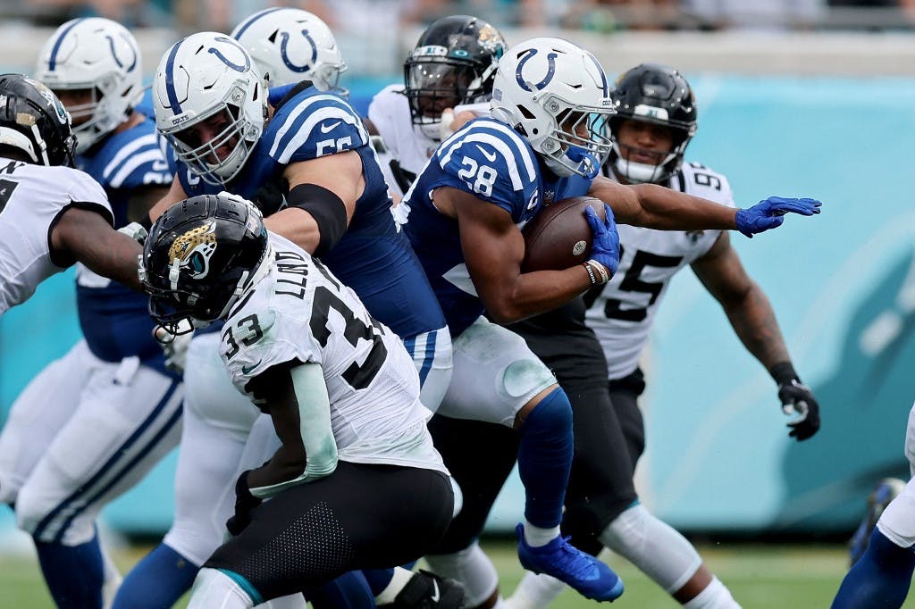 Jonathan Taylor #28 of the Indianapolis Colts carries the ball in the second half against the Jacksonville Jaguars at TIAA Bank Field on Sept. 18 in Jacksonville, Florida. Mike Carlson/Getty Images/AFP