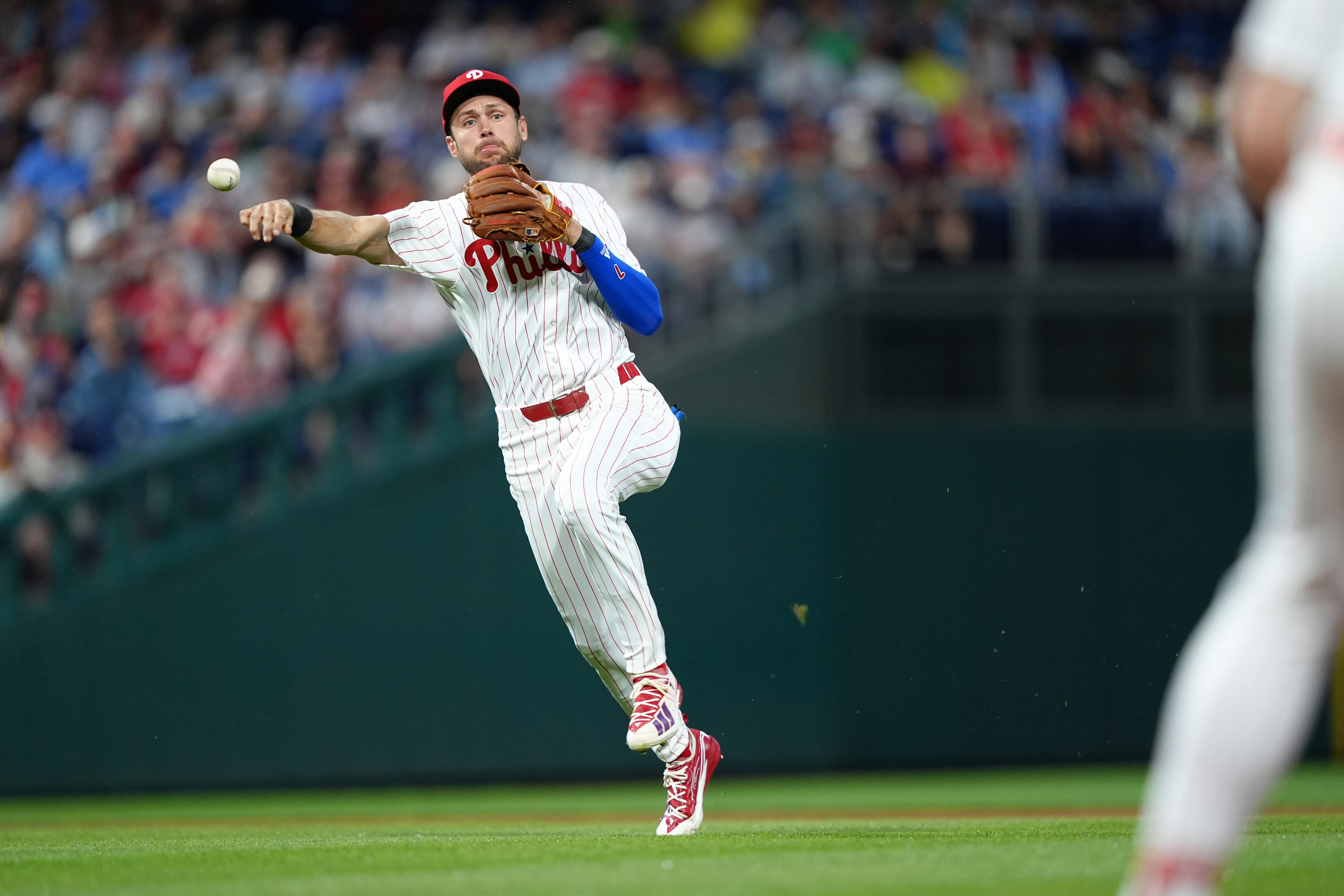 Philadelphia Phillies infielder Trea Turner (7) throws to first as he is featured in our Yankees vs. Phillies prediction.