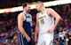 Dallas Mavericks guard Luka Doncic speaks with Denver Nuggets center Nikola Jokic during the second half at American Airlines Center. Jokic and Doncic lead the 2025 NBA MVP Odds.