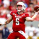Brennan Armstrong of the NC State Wolfpack throws the ball as we share our favorite NC State vs. Virginia prediction.