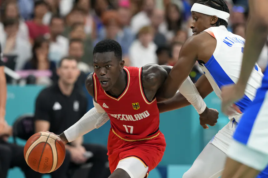 Germany point guard Dennis Schroder (17) controls the ball as we offer our best Germany vs. Greece prediction and expert picks for Tuesday's Olympic men's basketball quarterfinal in the Paris 2024 Olympics.