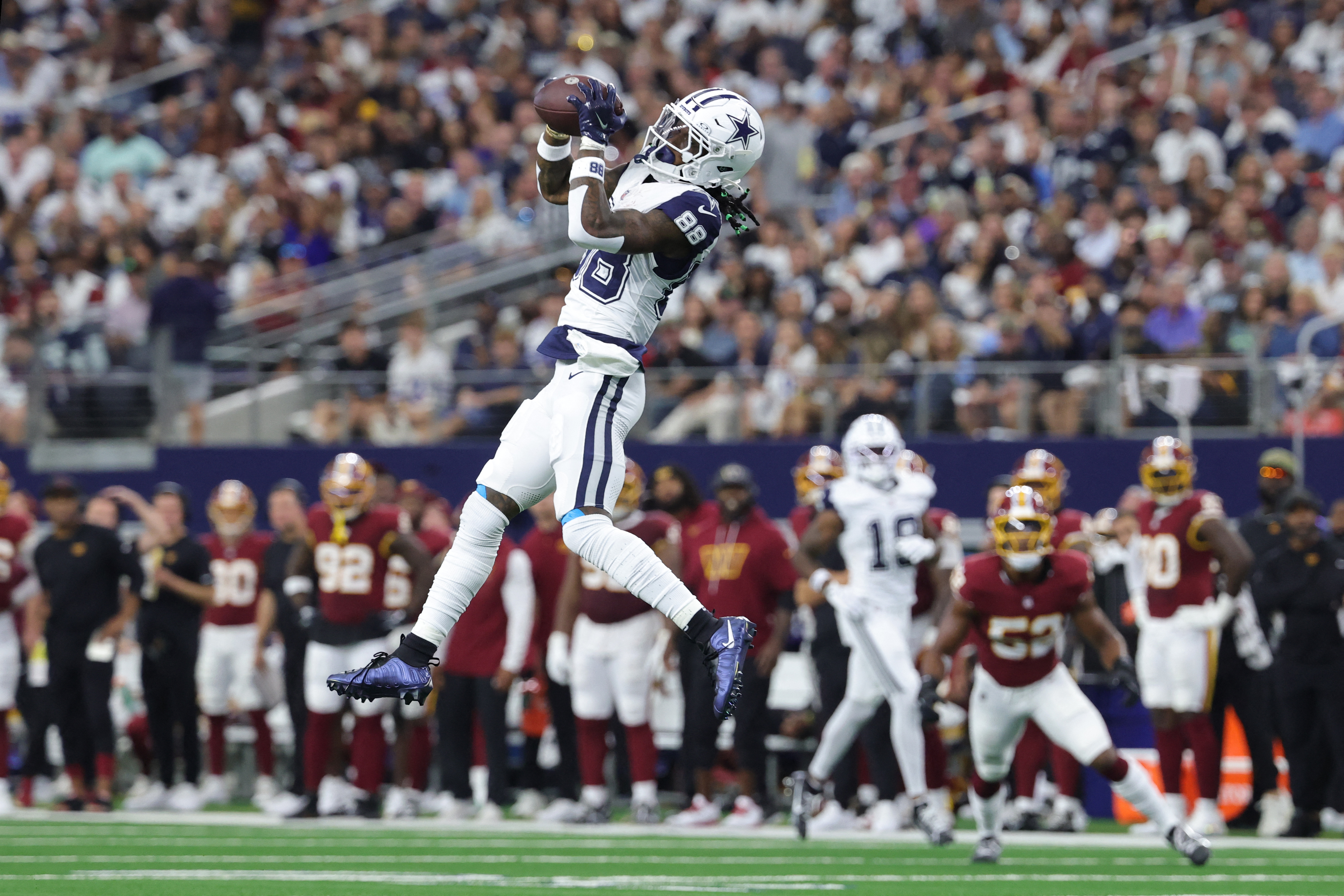 Dallas Cowboys wide receiver CeeDee Lamb (88) leaps to catch a pass as he is featurred in our Ravens vs. Cowboys touchdown pick.