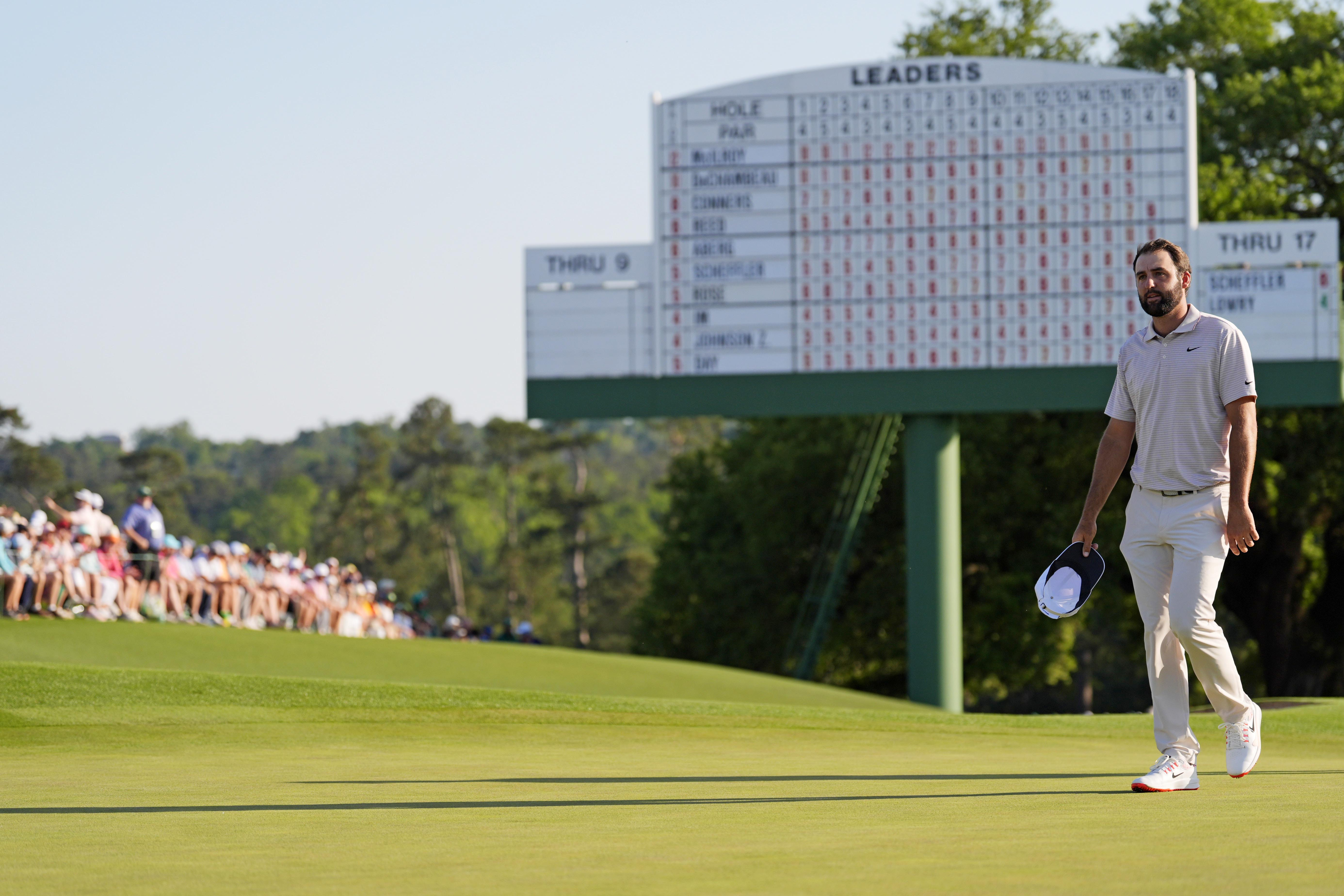 Scottie Scheffler waves to the patrons after finishing on the 18th green during the final round of the Masters, as we look at the 2026 Masters win probability