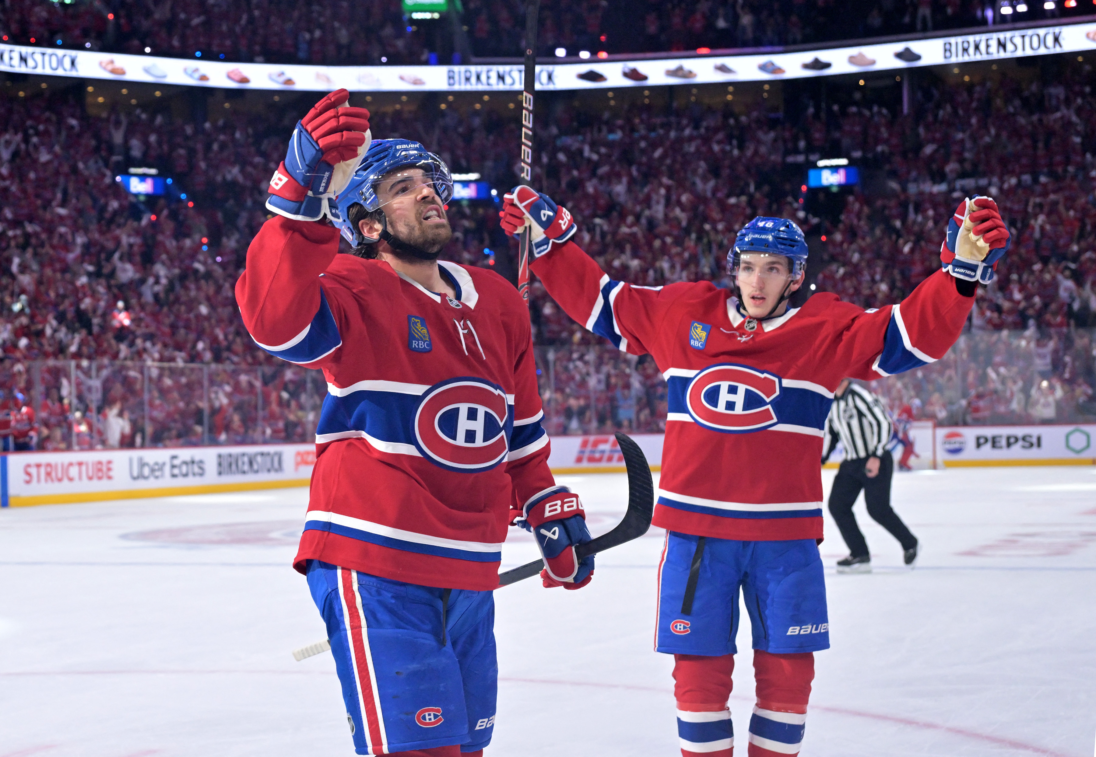 Montreal Canadiens forward Alex Newhook celebrates with Lane Hutson after scoring as we make our best Canadiens vs. Sabres prediction.
