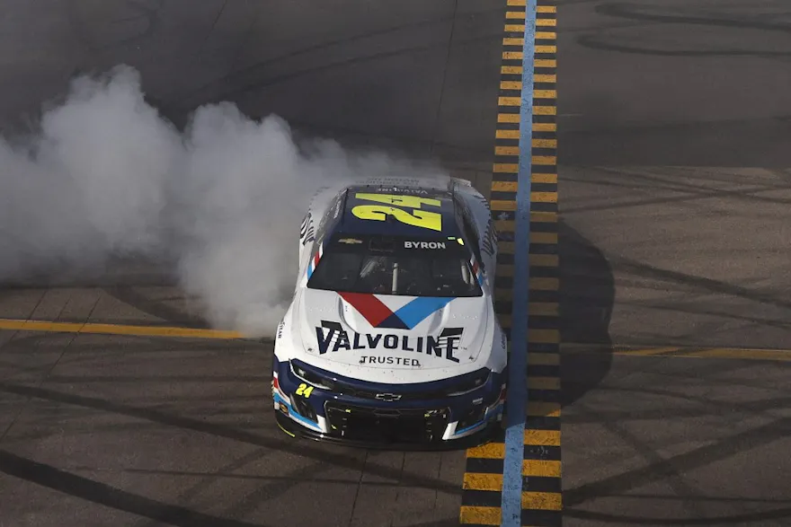 William Byron, driver of the #24 Valvoline Chevrolet, celebrates with a burnout after winning the NASCAR Cup Series United Rentals Work United 500 at Phoenix Raceway on Mar.12, 2023 in Avondale, Arizona.