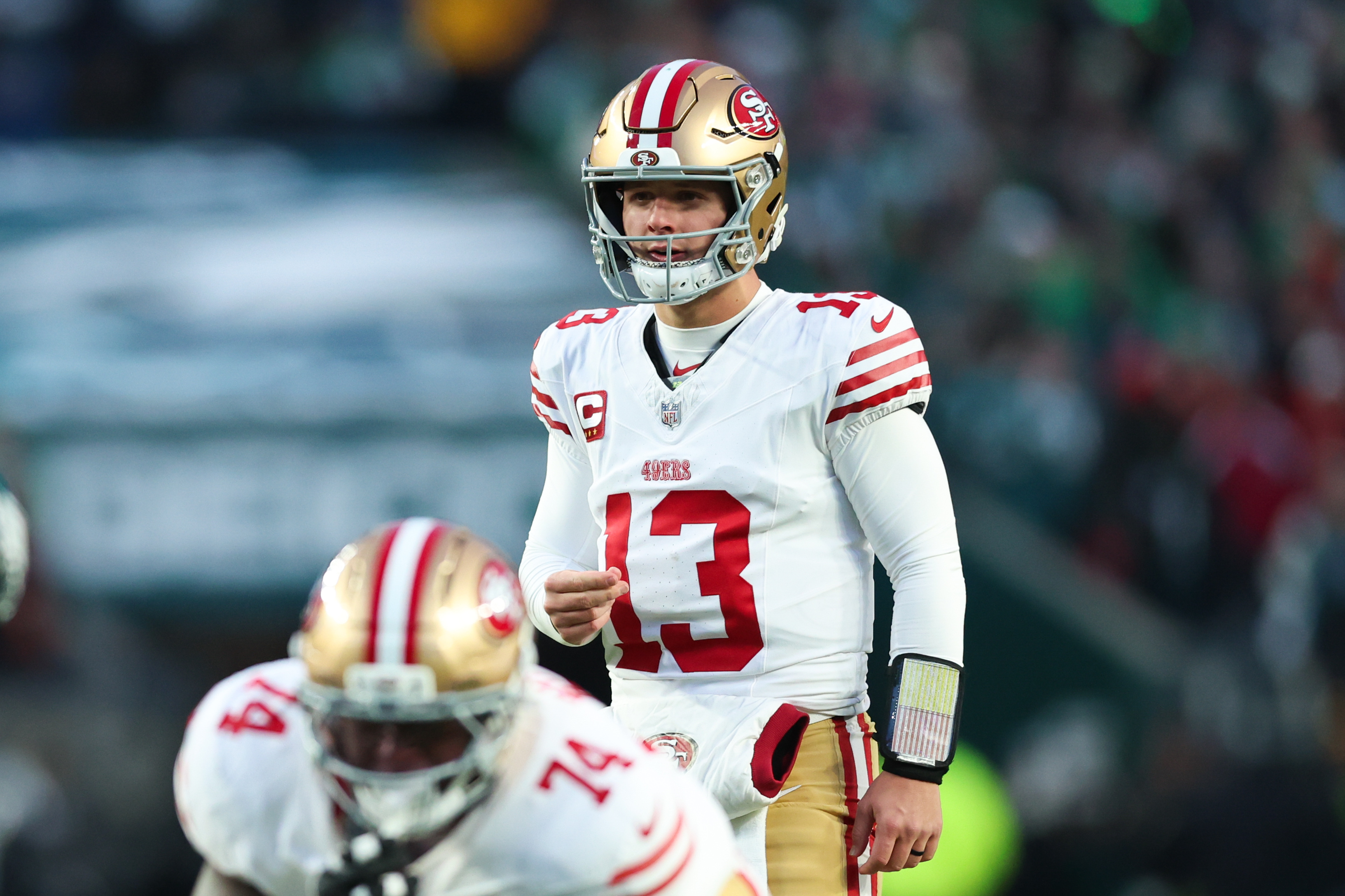 San Francisco 49ers quarterback Brock Purdy (13) prepares to snap the ball as we break down our Brock Purdy vs. Sam Darnold player props for NFL Divisional Round.