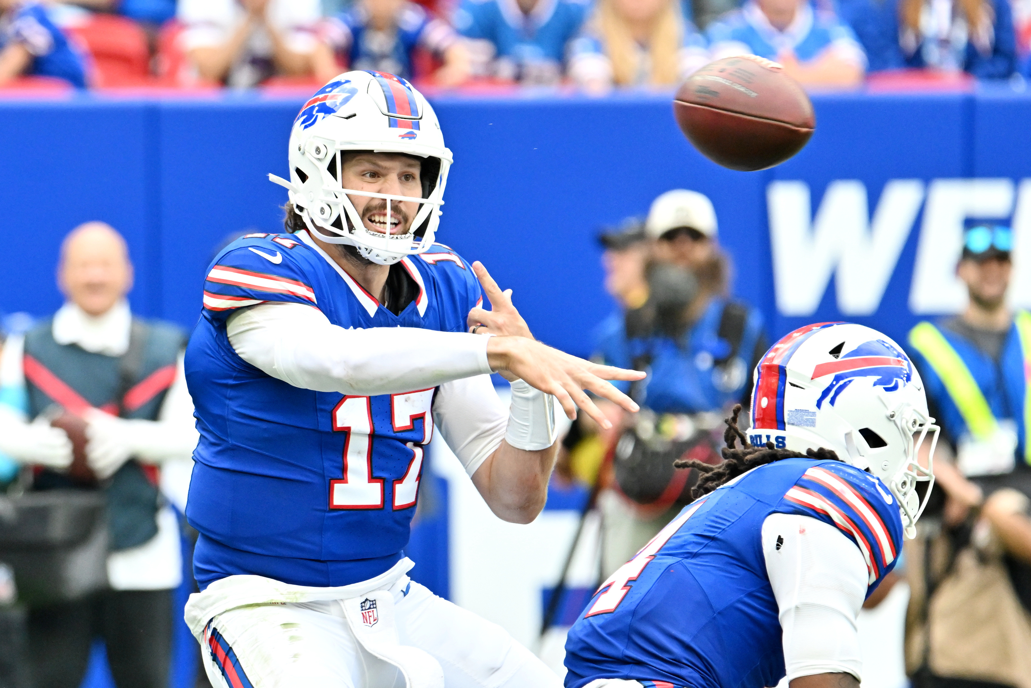 Buffalo Bills quarterback Josh Allen throws a pass as we make our best Bills vs. Rams expert picks. 