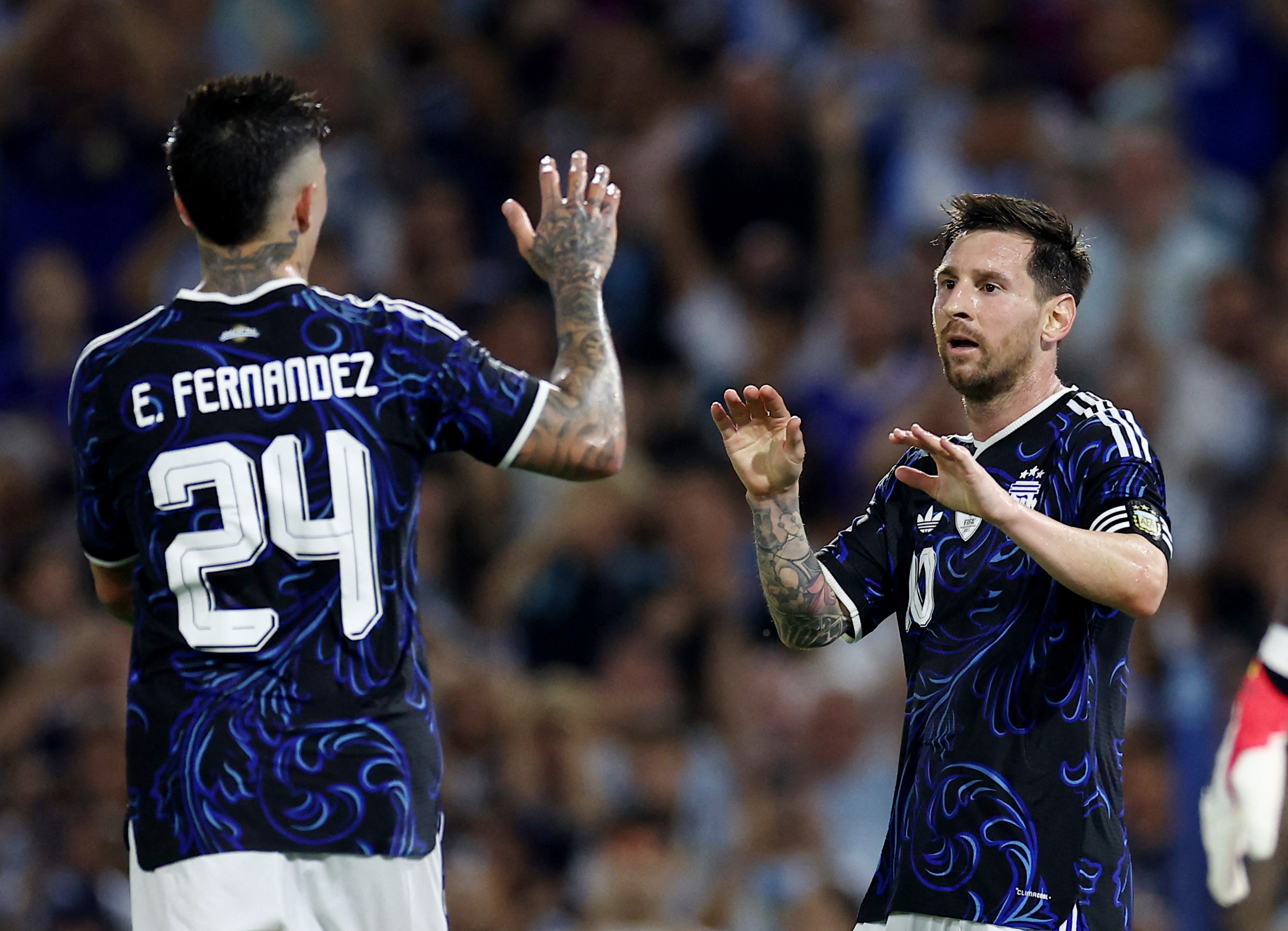 Argentina's Lionel Messi and Enzo Fernandez celebrate as we look at the Argentina World Cup odds.