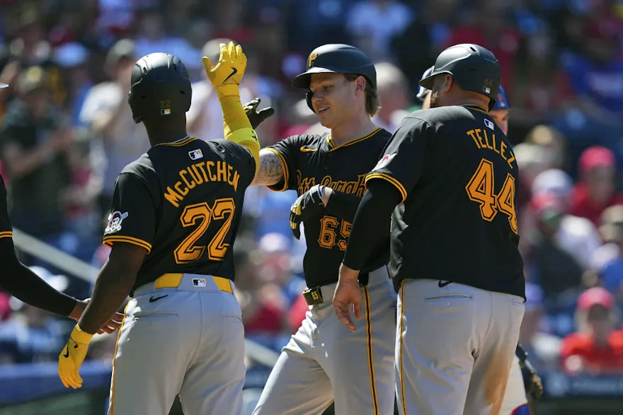 Jack Suwinski of the Pittsburgh Pirates celebrates with Andrew McCutchen and Rowdy Tellez after hitting a grand slam.