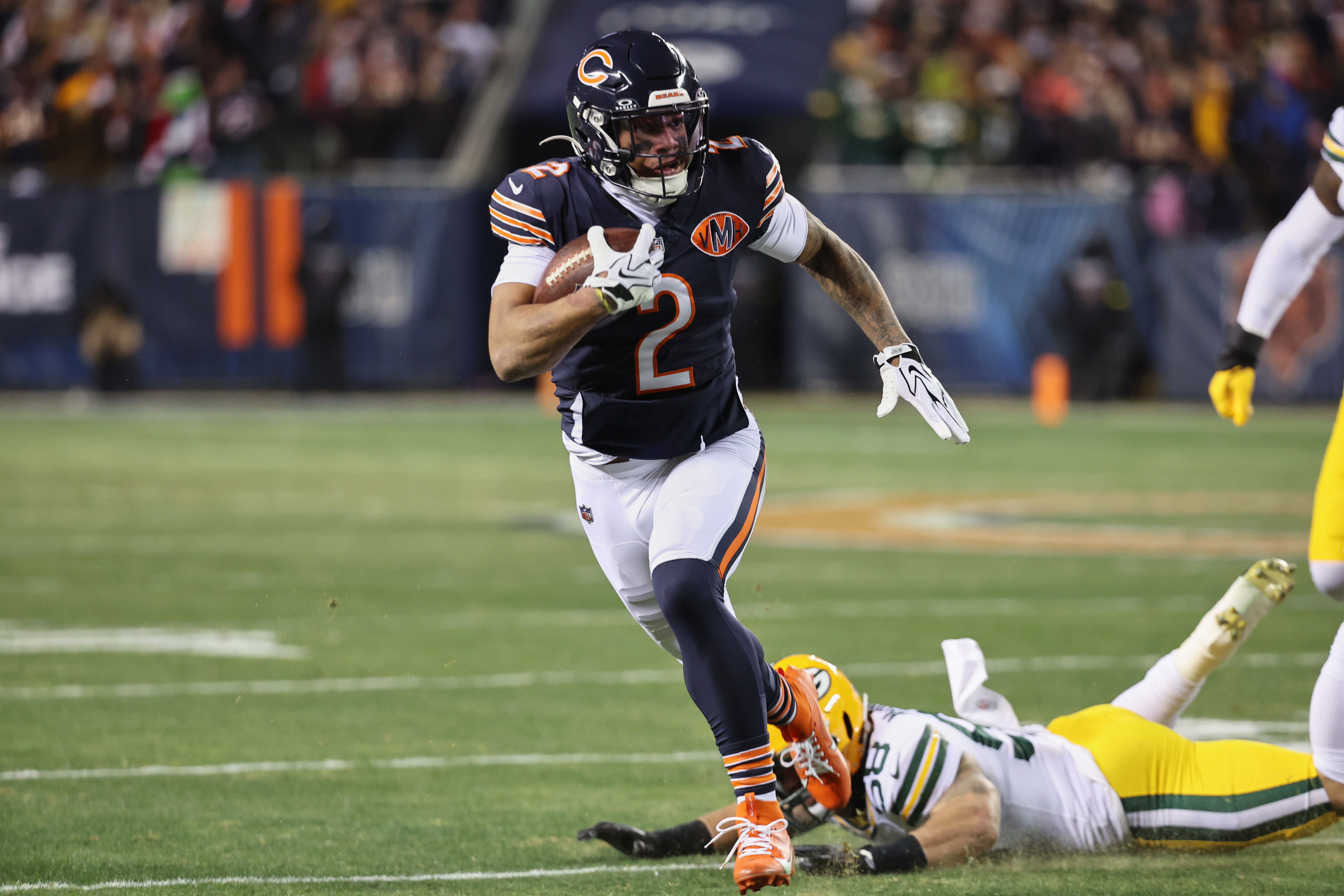 Chicago Bears wide receiver DJ Moore (2), who is featured in our Packers vs. Bears AI picks, runs after the catch against the Green Bay Packers.