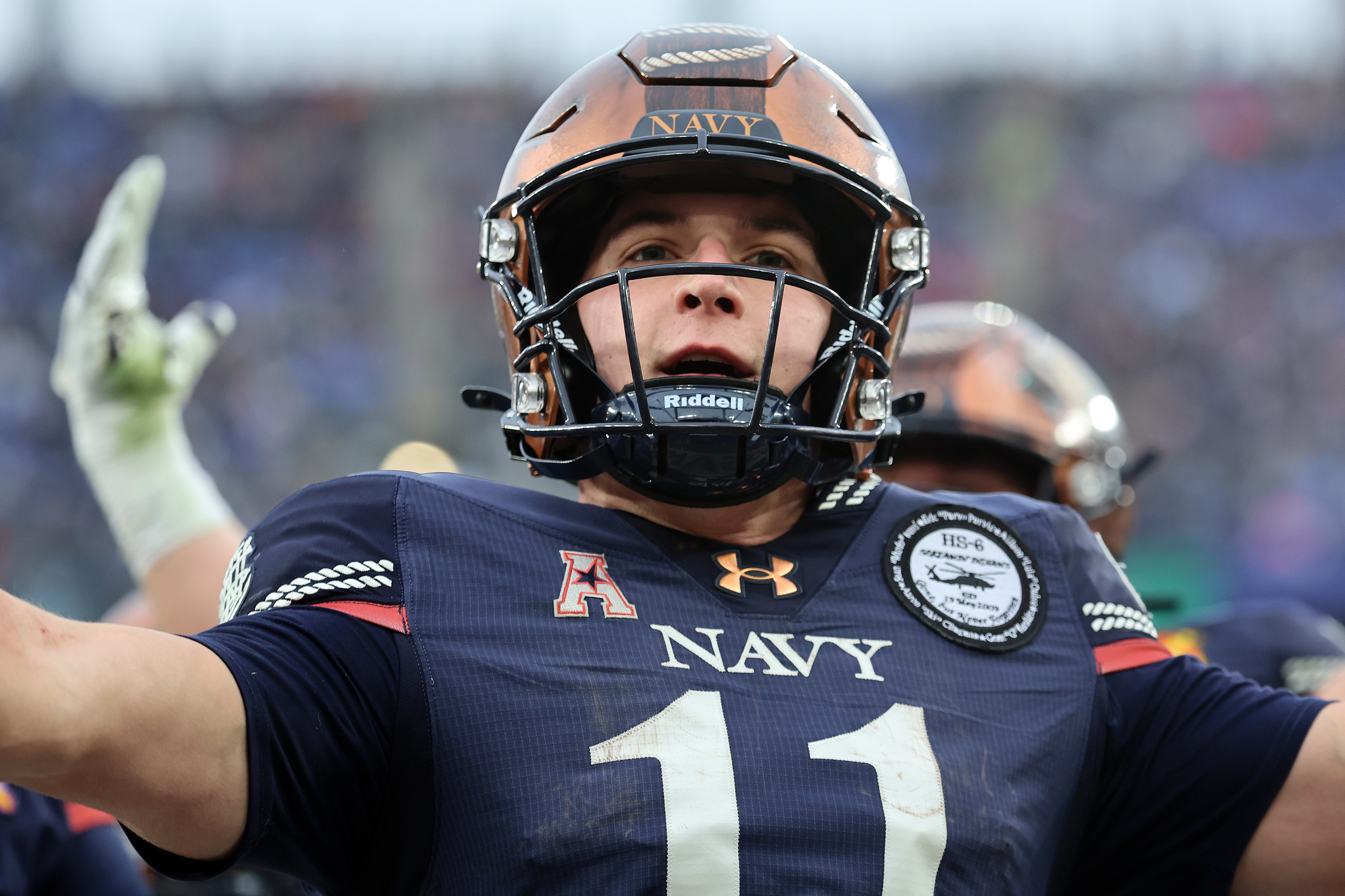 Navy Midshipmen quarterback Blake Horvath reacts after scoring a touchdown as we look at our college bowl game predictions