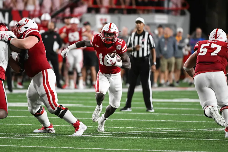 Anthony Grantof the Nebraska Cornhuskers runs through a hole against the Indiana Hoosiers in the fourth quarter of the game at Memorial Stadium on October 1, 2022 in Lincoln, Nebraska.