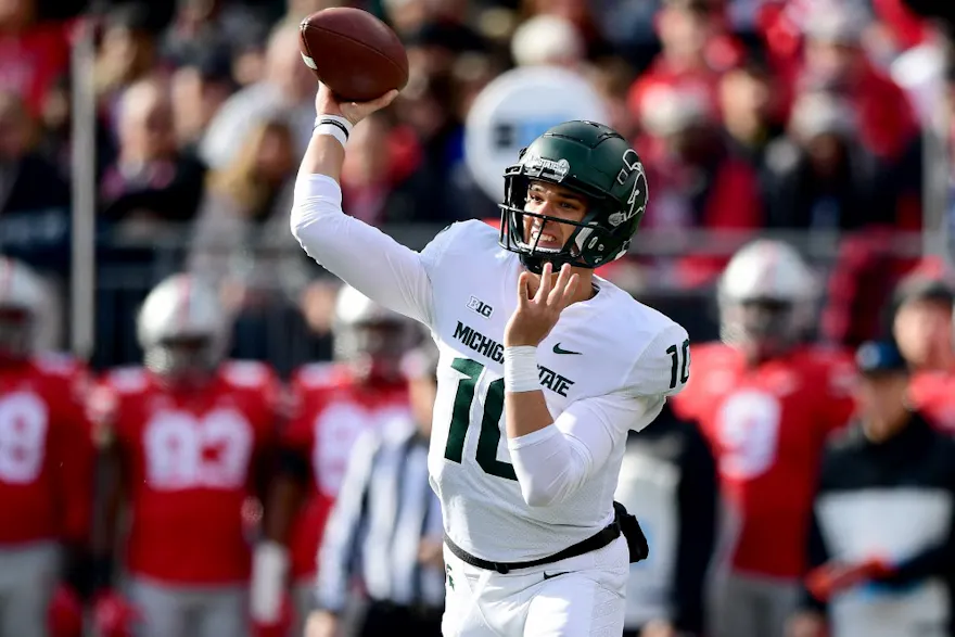 Payton Thorne #10 of the Michigan State Spartans throws a pass during the first half of a game against the Ohio State Buckeyes at Ohio Stadium on Nov. 20, 2021.