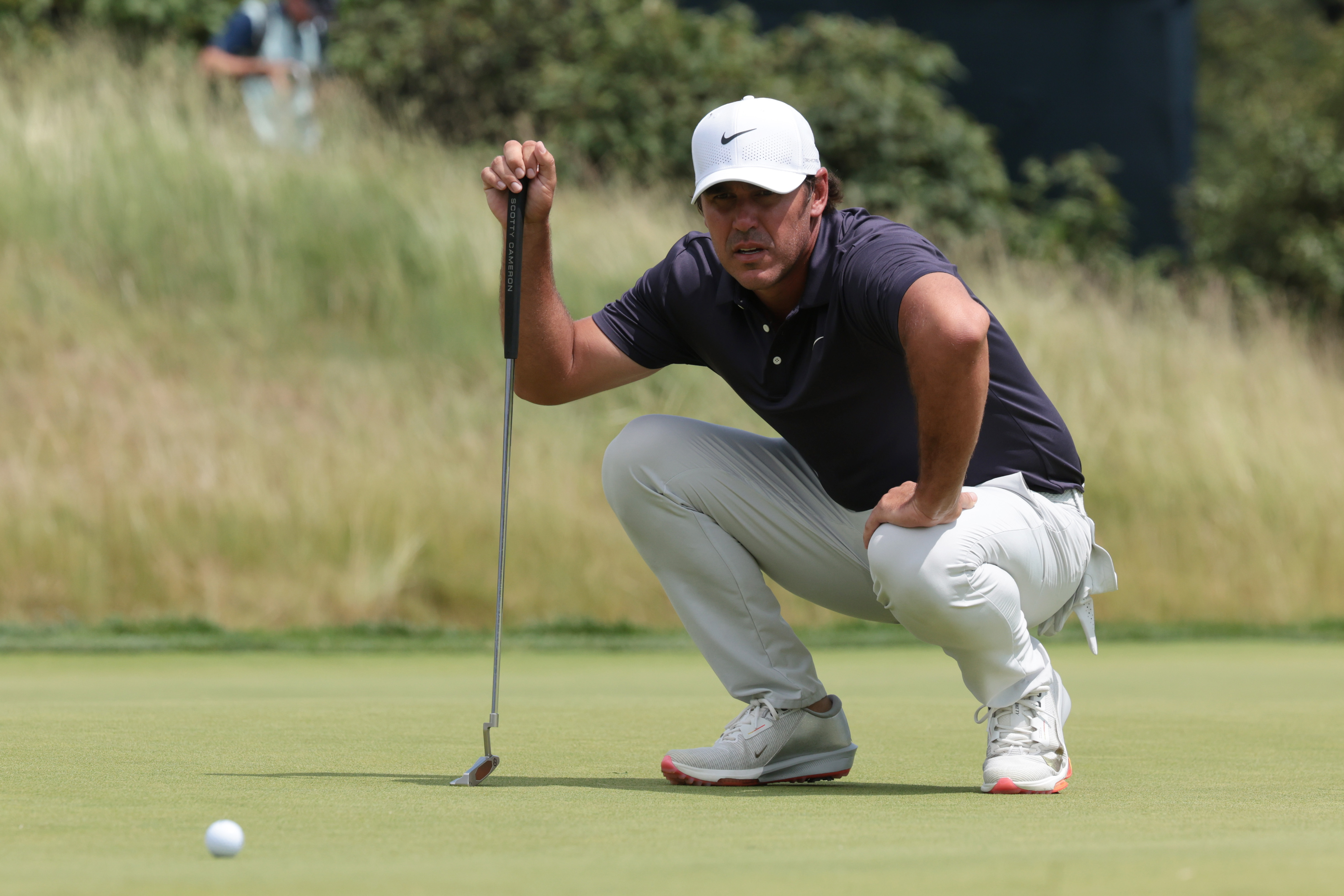 Brooks Koepka - who's featured in my Farmers Insurance Open picks - prepares to putt.