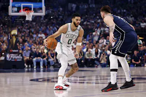 Boston Celtics forward Jayson Tatum dribbles the ball against Dallas Mavericks guard Luka Doncic during Game 4 of the 2024 NBA Finals. We're backing Tatum in our Mavericks vs. Celtics Last Minute Predictions.
