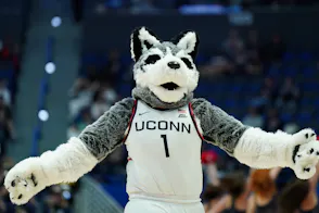 UConn Huskies mascot on the court during a break in the action as we look at Connecticut's July sports betting financials.