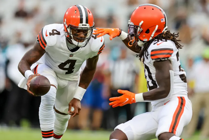 Deshaun Watson of the Cleveland Browns hands the ball off to D'Ernest Johnson against the Jacksonville Jaguars at TIAA Bank Field in Jacksonville, Florida. Photo by Mike Carlson/Getty Images via AFP. 