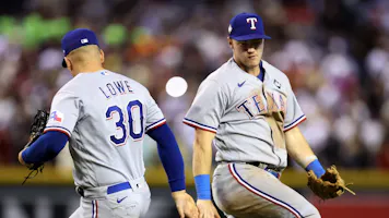Nathaniel Lowe #30 and Josh Jung #6 of the Texas Rangers celebrate as we look at our Rangers vs. Diamondbacks World Series Game 5 prediction