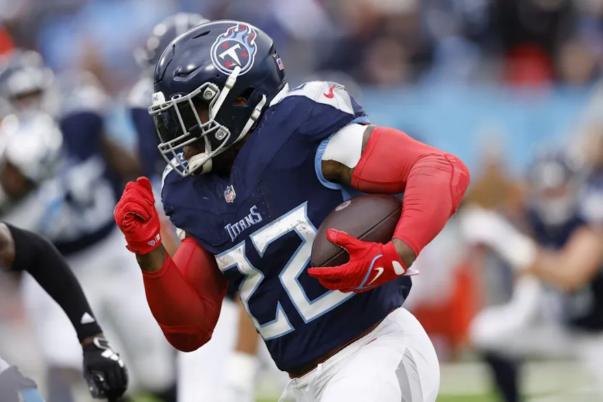 Derrick Henry of the Tennessee Titans runs the ball ahead of our Week 13 NFL predictions for Colts vs. Titans