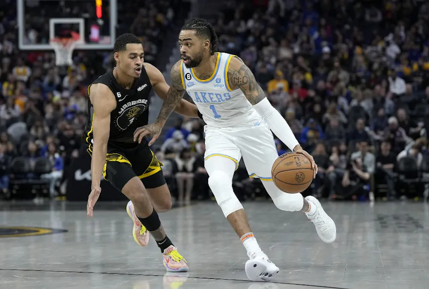 D'Angelo Russell of the Los Angeles Lakers dribbles past Jordan Poole of the Golden State Warriors at Chase Center in San Francisco, California. Photo by Thearon W. Henderson/Getty Images via AFP. 