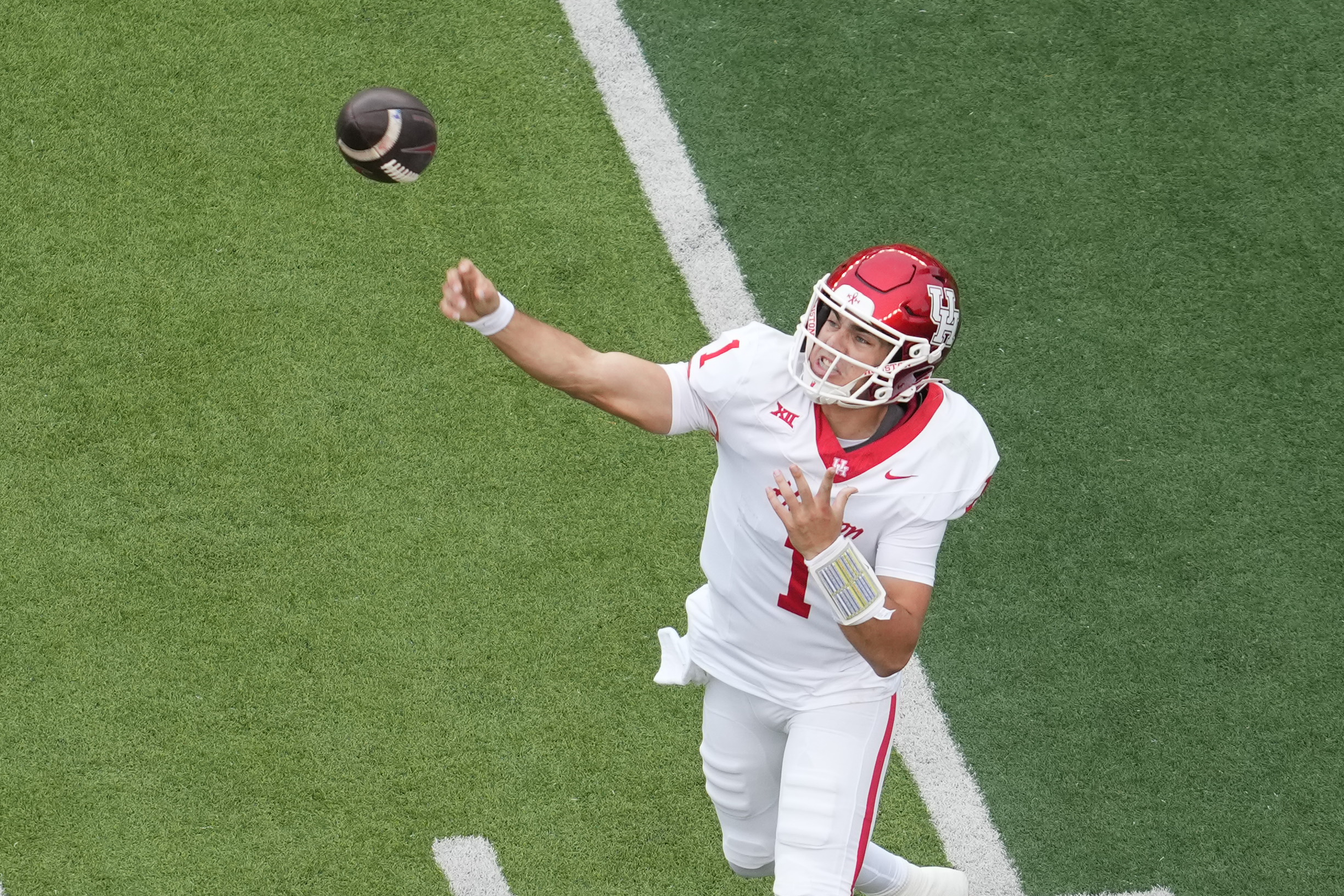 Houston Cougars quarterback Conner Weigman passes the ball as we make our best Oregon State vs. Houston prediction.