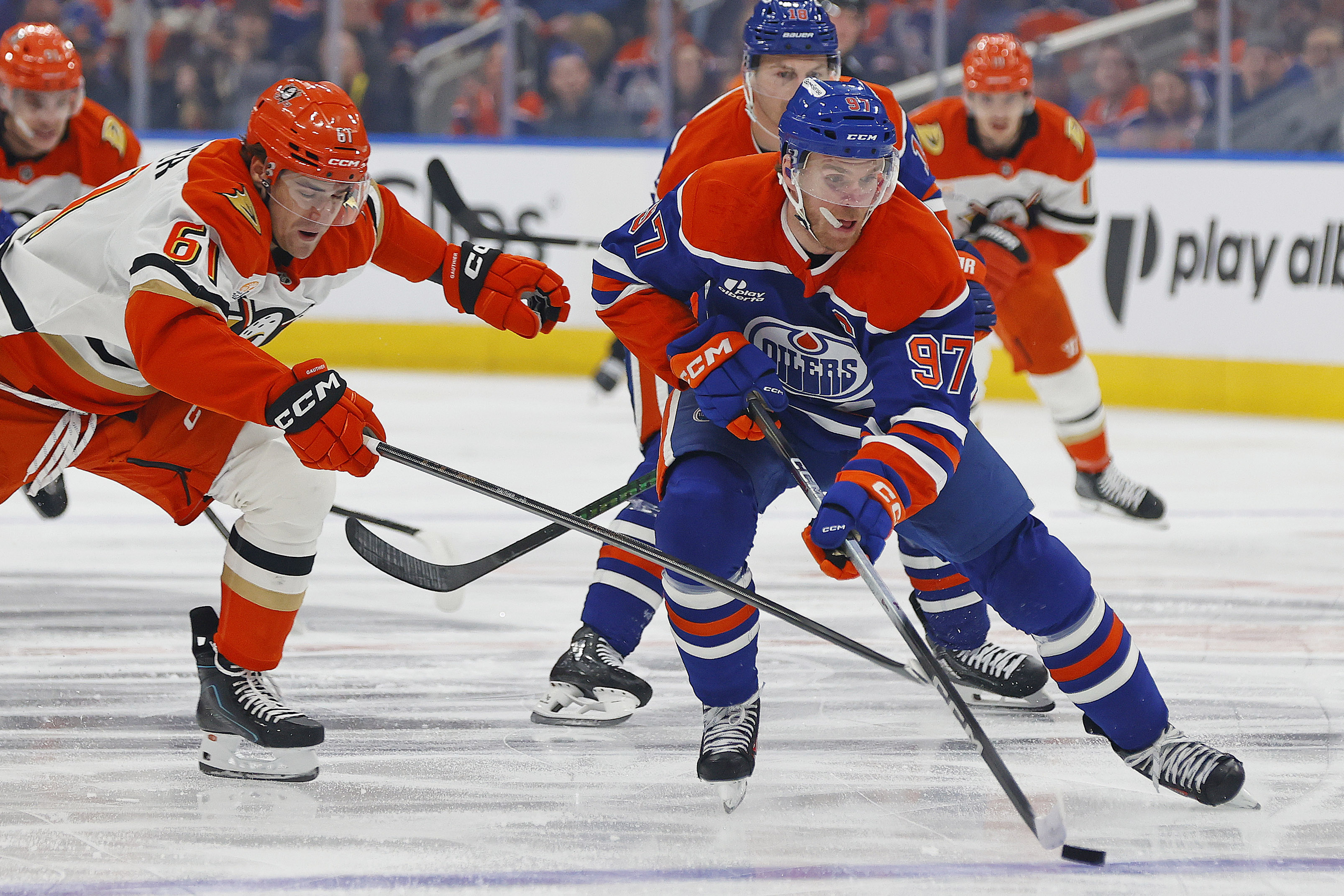 Anaheim Ducks forward Cutter Gauthier (61) tries to knock the puck away from Edmonton Oilers forward Connor McDavid (97) as we provide our Oilers vs. Ducks Game 4 prediction.