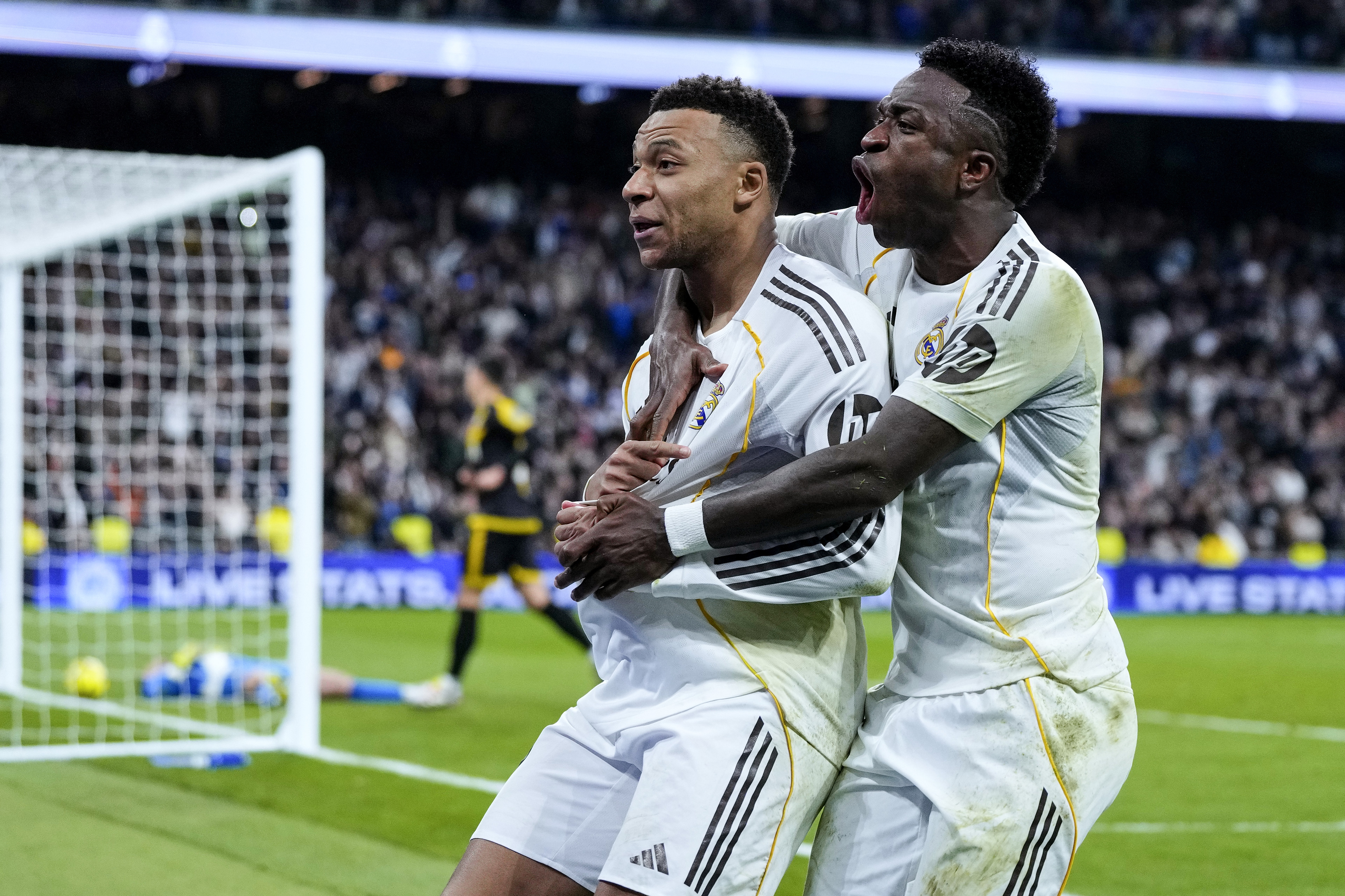 Kylian Mbappe and Vinicius Jr Junior celebrate as we offer our Benfica vs. Real Madrid prediction and parlay for today's game.
