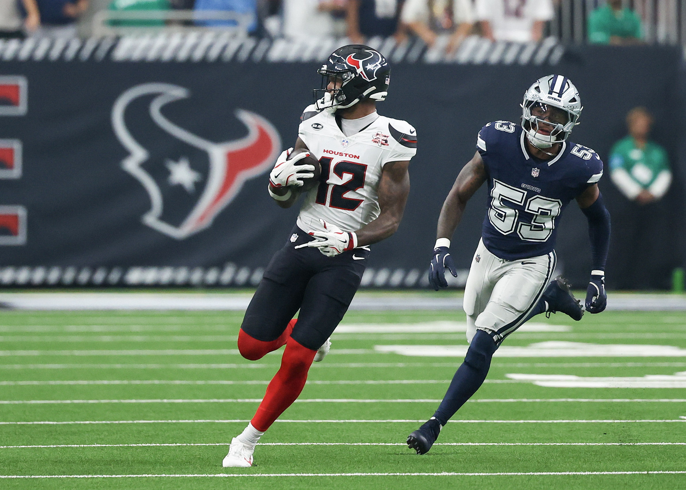 Houston Texans wide receiver Nico Collins (12) runs after the catch as he is featured in our NFL anytime touchdown scorer predictions.