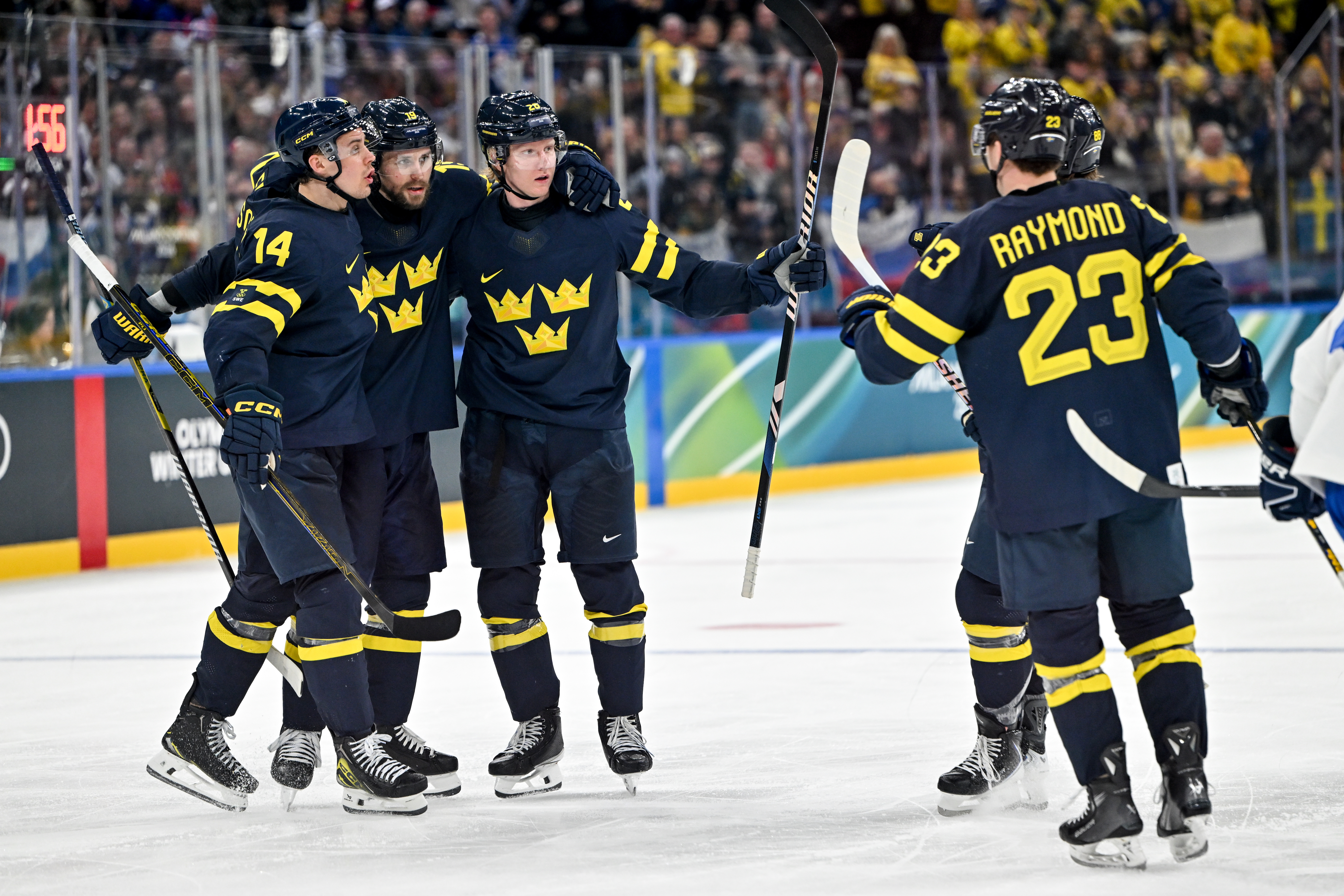 Swedish teammates celebrate a goal as we provide our Sweden vs. Latvia prediction.