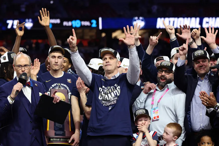 Head coach Dan Hurley of the Connecticut Huskies celebrates with his team as we offer our best March Madness predictions and picks for every game of the 2025 NCAA Tournament.