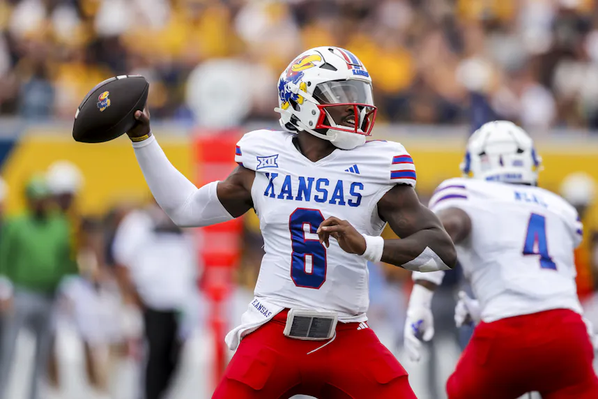 Kansas Jayhawks quarterback Jalon Daniels throws a pass during the first quarter against the West Virginia Mountaineers as we look at our College Football Week 6 Player Prop Picks.