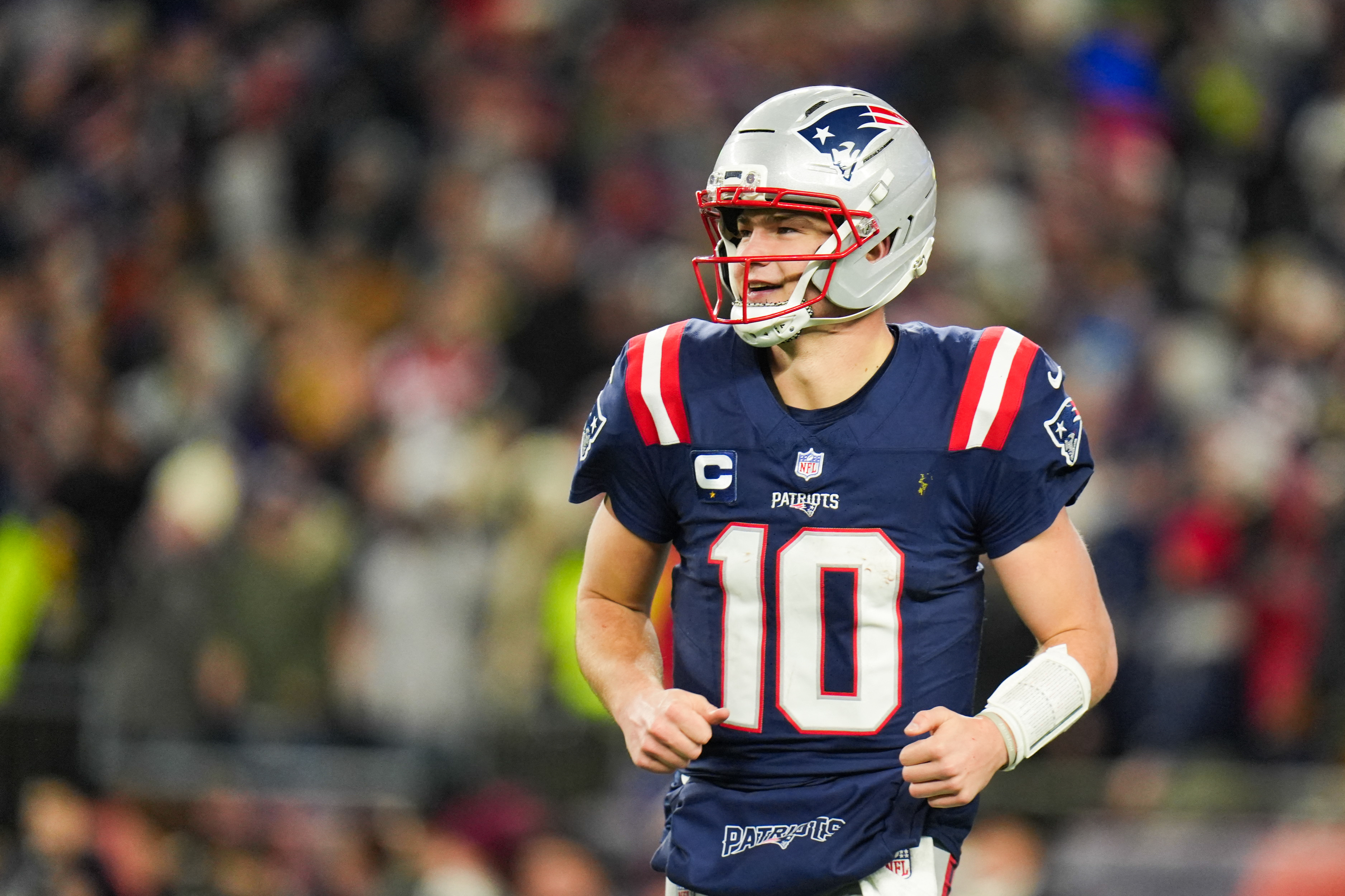 New England Patriots quarterback Drake Maye (10) smiles after a touchdown as we break down the NFL weather report for the Divisional Round.