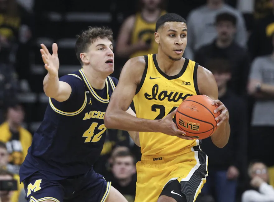 Forward Kris Murray of the Iowa Hawkeyes squares off during the first half against forward Will Tschetter of the Michigan Wolverines at Carver-Hawkeye Arena. Photo by Matthew Holst/Getty Images/AFP.
