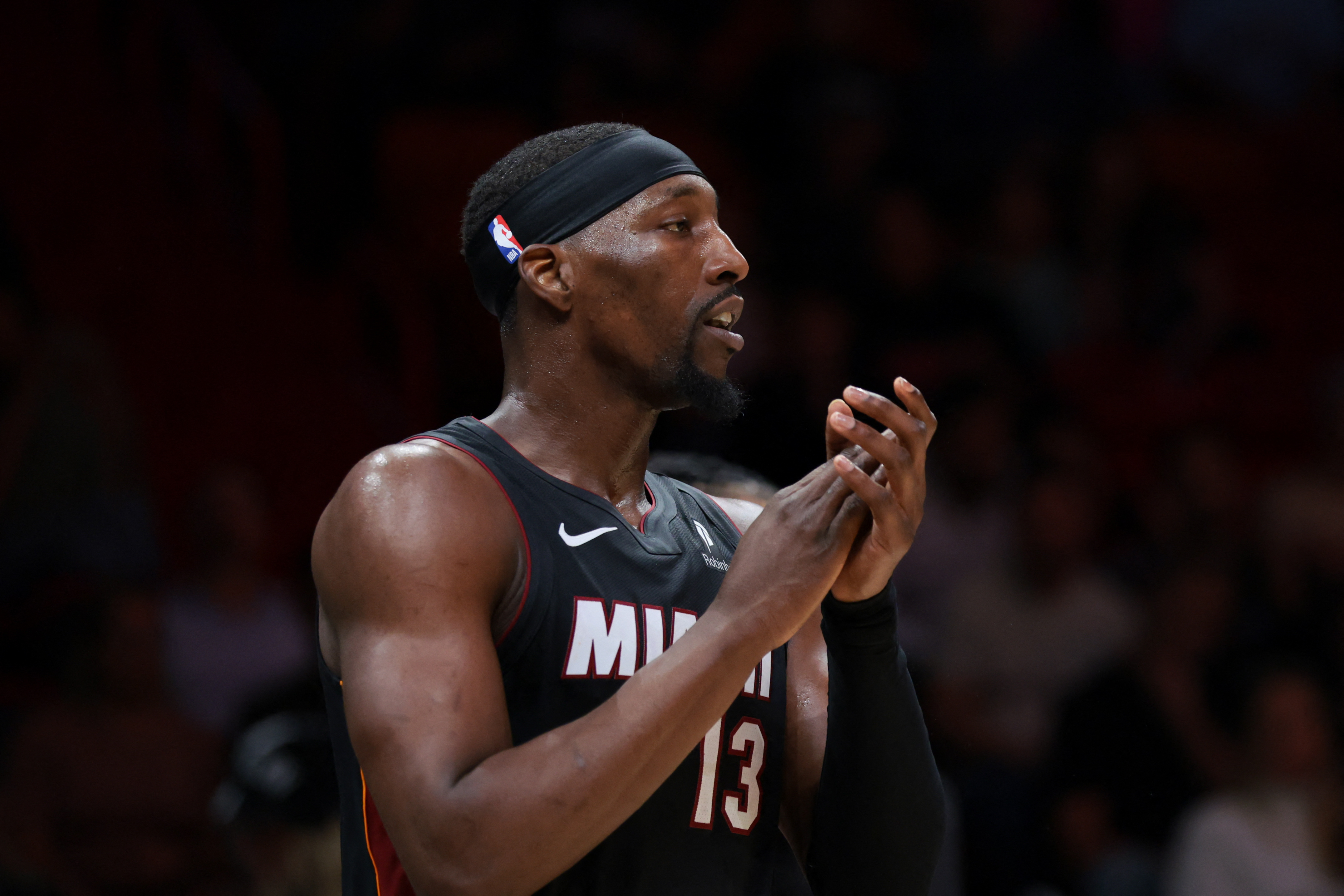 Miami Heat center Bam Adebayo (13), seen here reacting during a game, is featured in our NBA player props today.