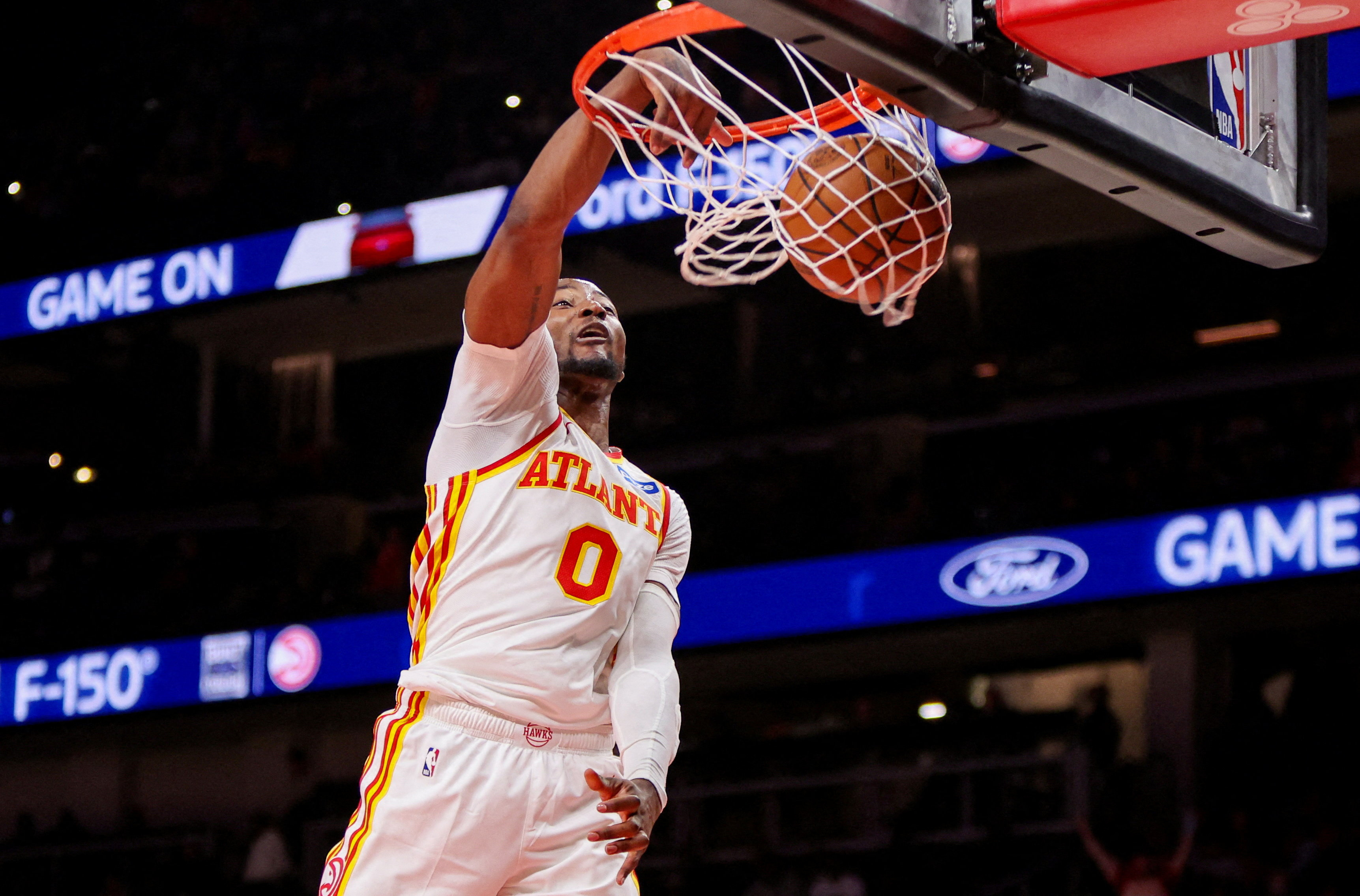 Atlanta Hawks forward Jonathan Kuminga (0) dunks as we break down our NBA Play of the Day.