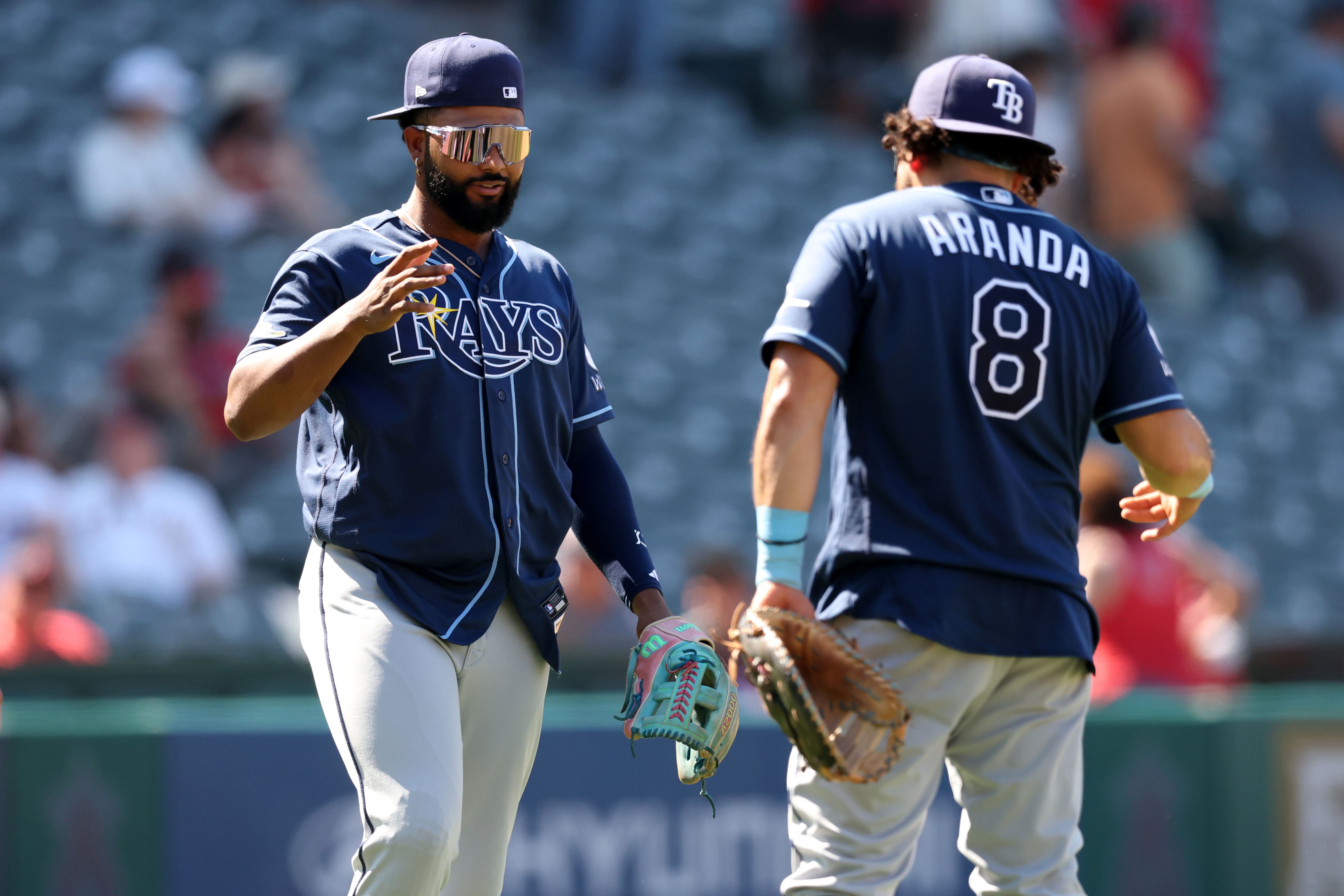 Tampa Bay Rays third baseman Junior Caminero celebrates with first baseman Jonathan Aranda, and he's featured in the Rays vs. Dodgers win probability.