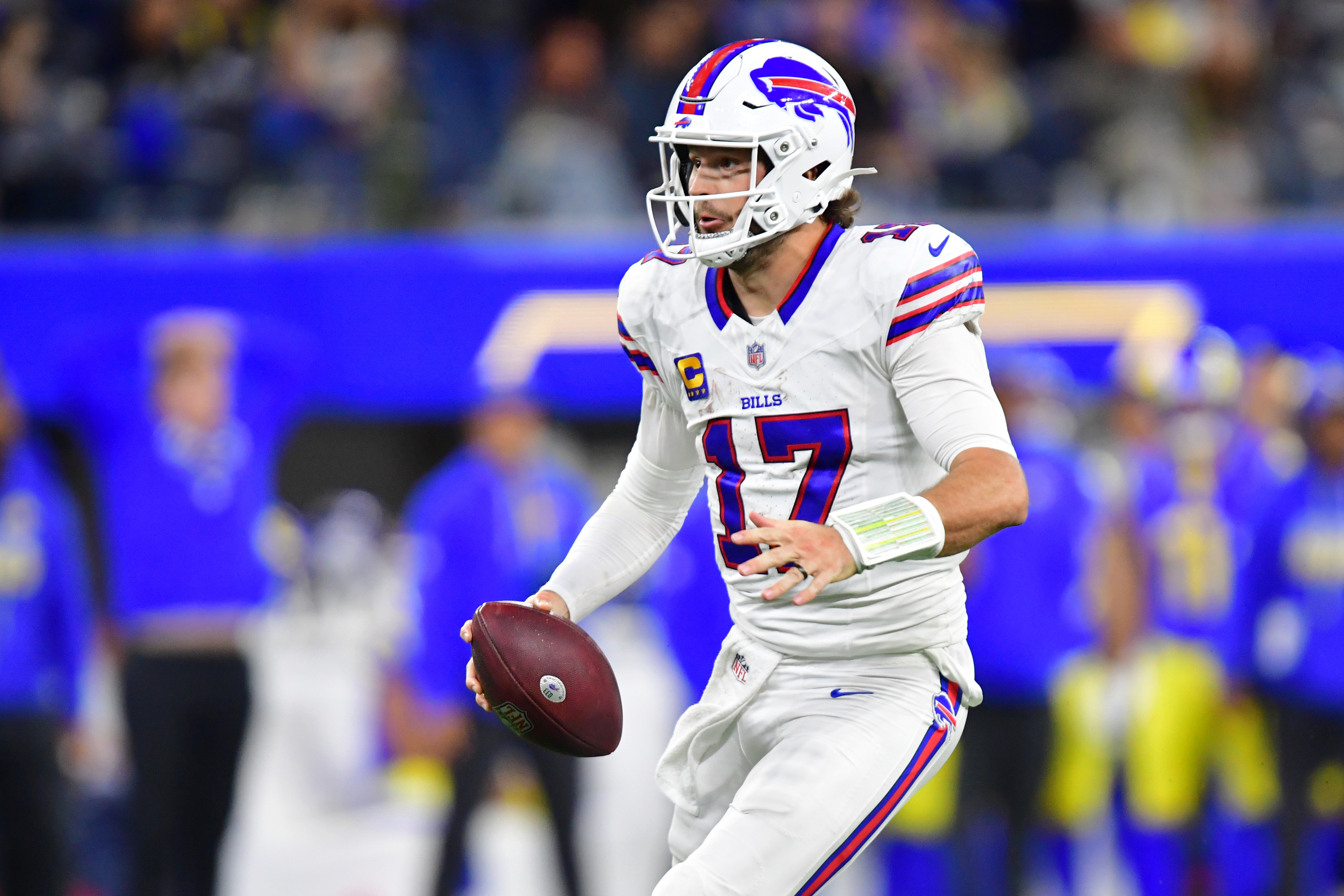 Buffalo Bills quarterback Josh Allen (17) scrambles as we provide our Bills vs. Raiders prediction.