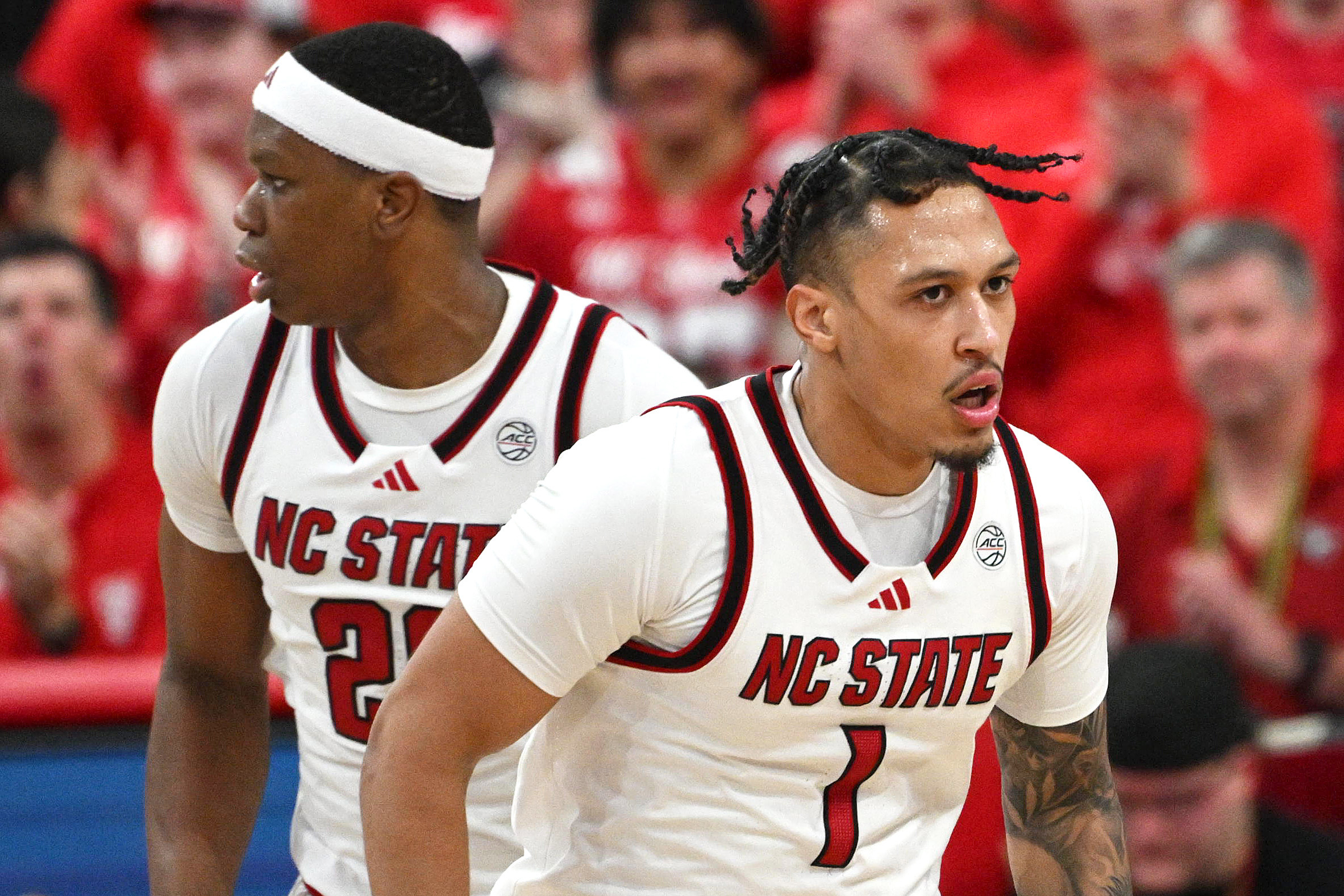 NC State Wolfpack forward Darrion Williams (1), seen here looking on after scoring, is featured in our First Four player props tonight.