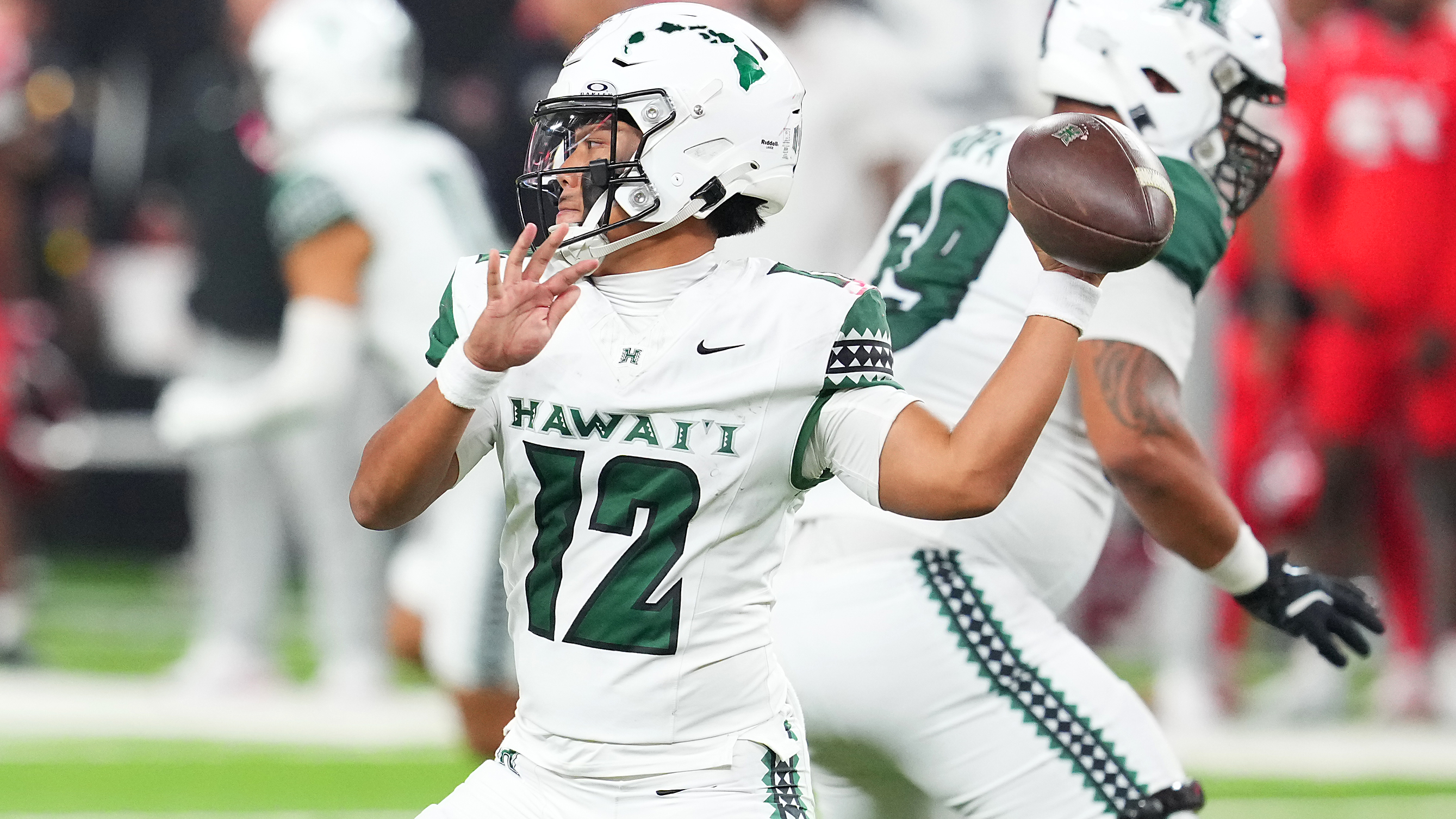 Hawaii Rainbow Warriors quarterback Micah Alejado (12) looks to make a pass against the UNLV Rebels during the fourth quarter at Allegiant Stadium.