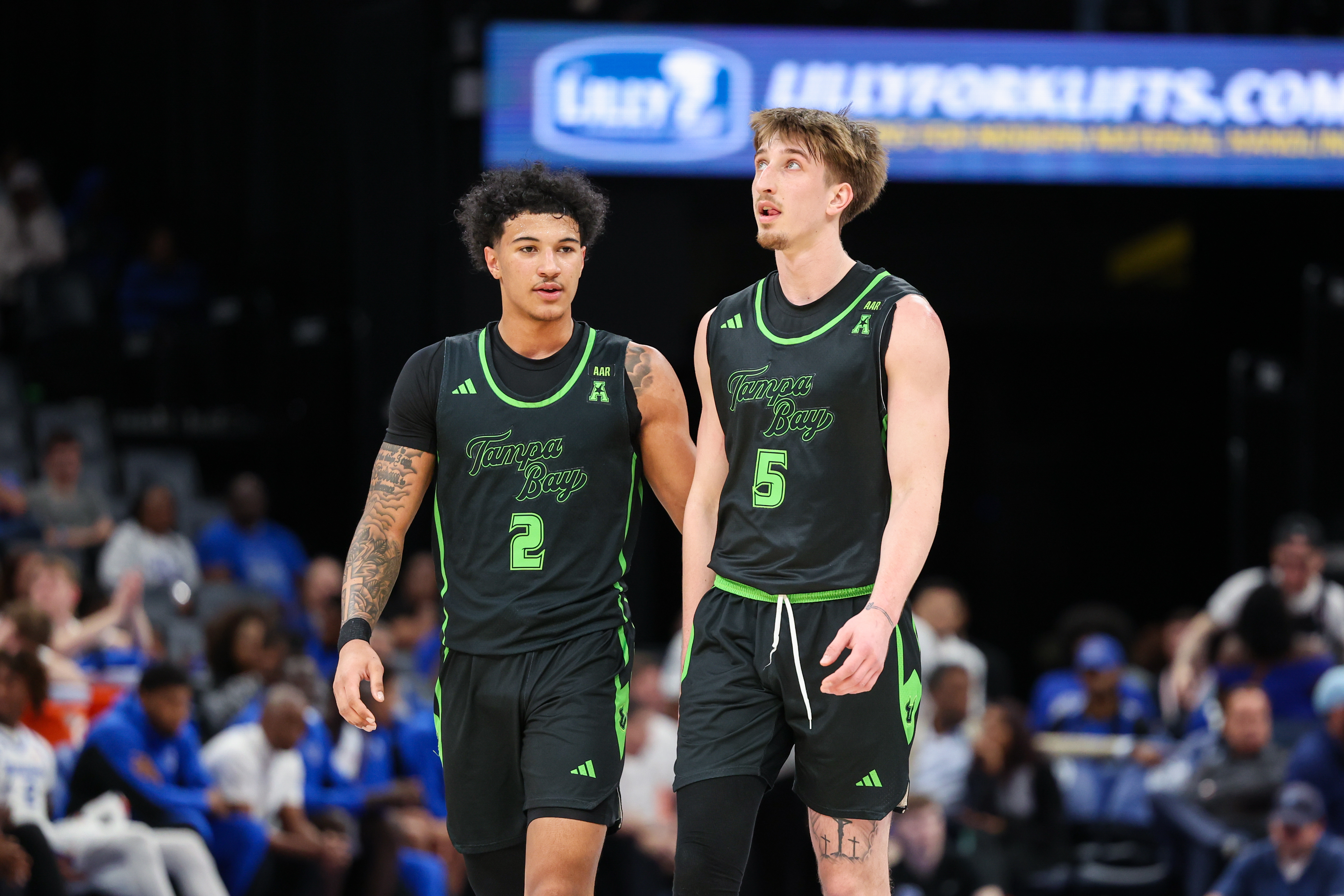 outh Florida Bulls guard Wes Enis (2) and guard Joseph Pinion (5) look on as we break down our South Florida vs. Louisville prediction.