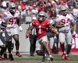 Ohio State Buckeyes running back Quinshon Judkins runs the football for the scarlet team during the first half of the LifeSports spring football game. The Buckeyes have the shortest 2025 College Football Playoff Odds.