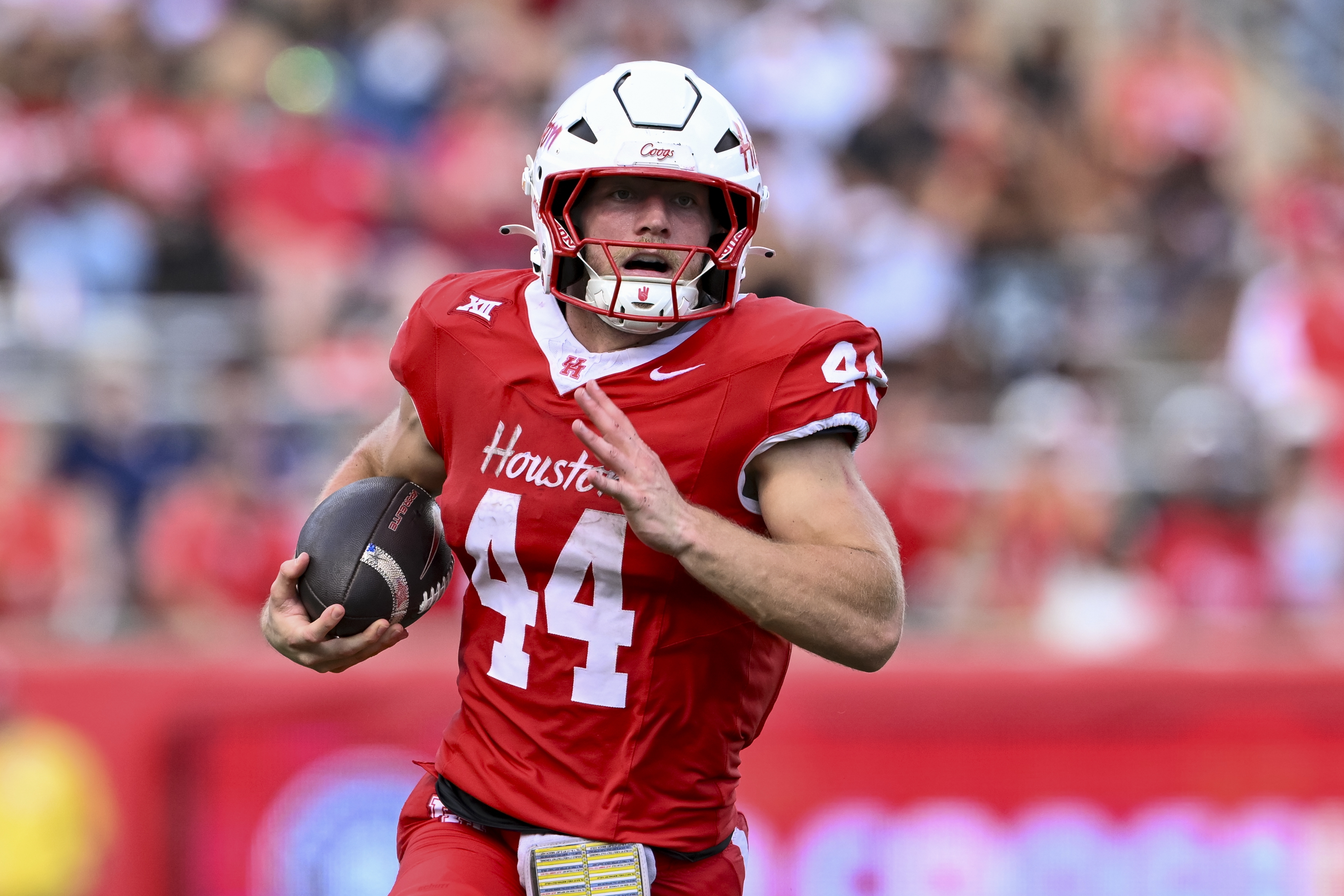 Houston running back Dean Connors (44) runs the ball as we offer our LSU vs. Houston predictions today.