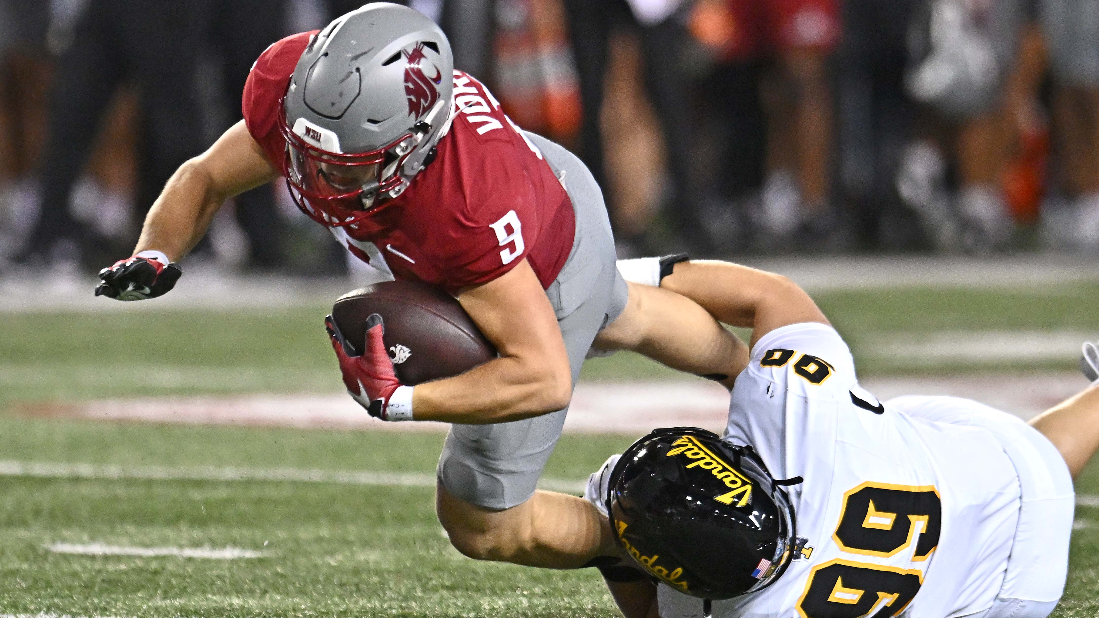 Washington State Cougars running back Kirby Vorhees is tackled as we make our best player prop bets for Week 1 of the college football season