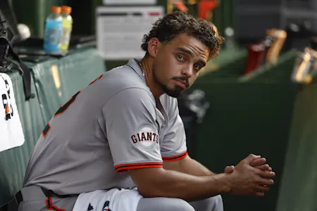 San Francisco Giants starting pitcher Jordan Hicks sits in the dugout as we look at the MLB Best Bets & Expert Picks for Saturday, June 22.